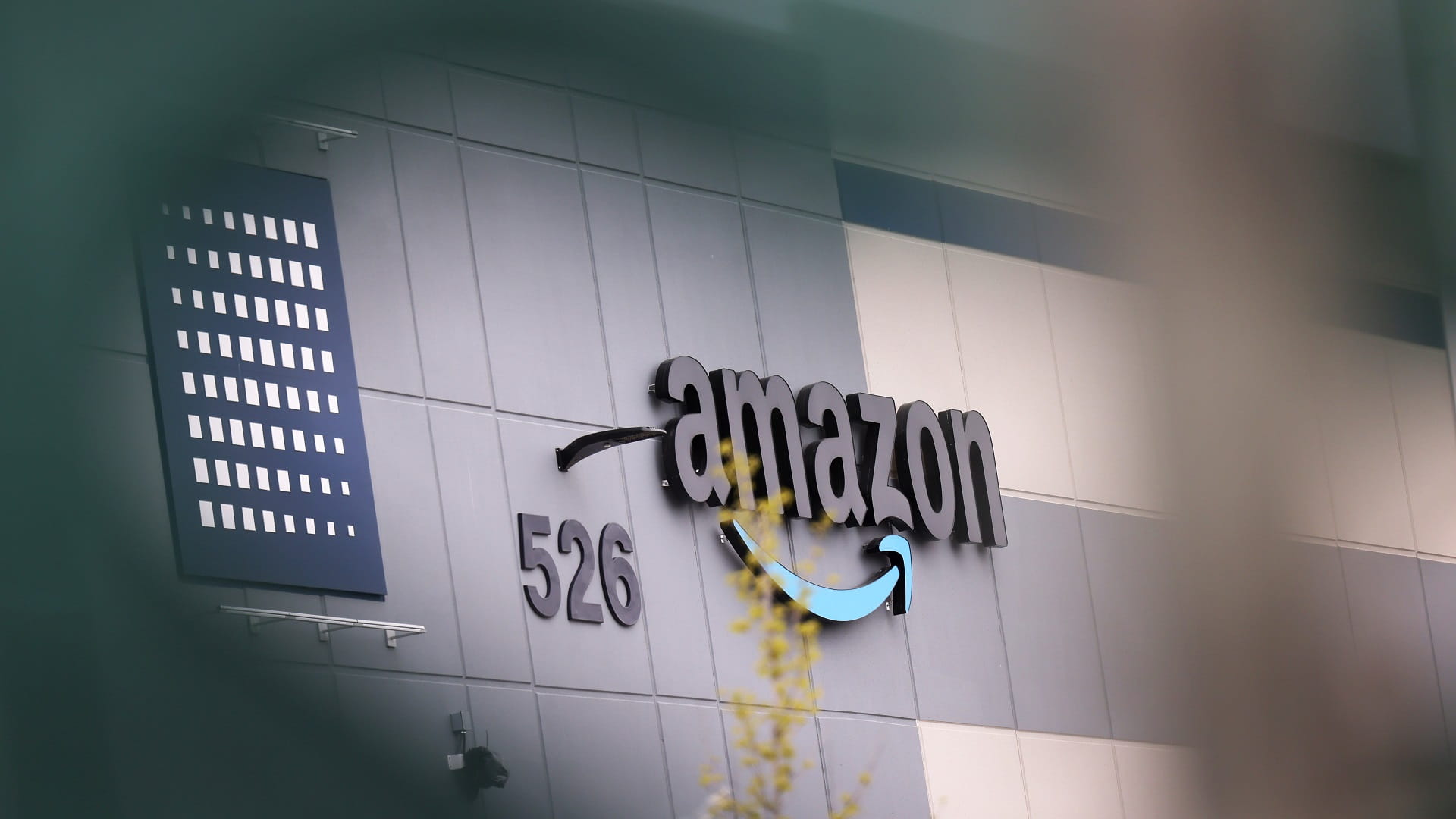 Image for the title: UK Amazon staff walk out in pay dispute 