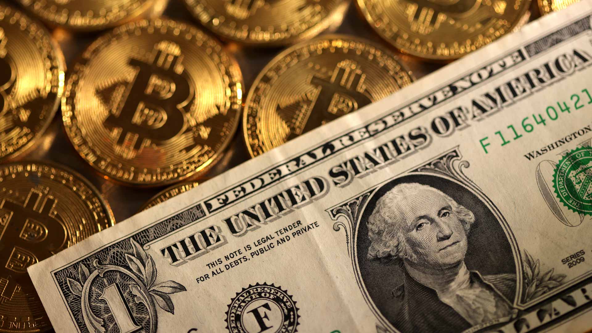 Image for the title: Dollar bruised after U.S. inflation comes in below expectations 