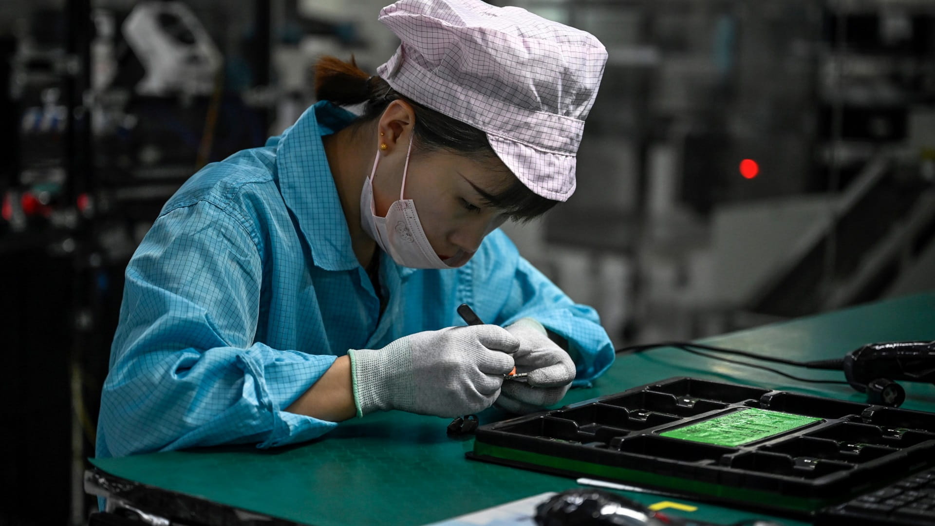 Image for the title: China's factory output, retail sales up but weaker than expected 