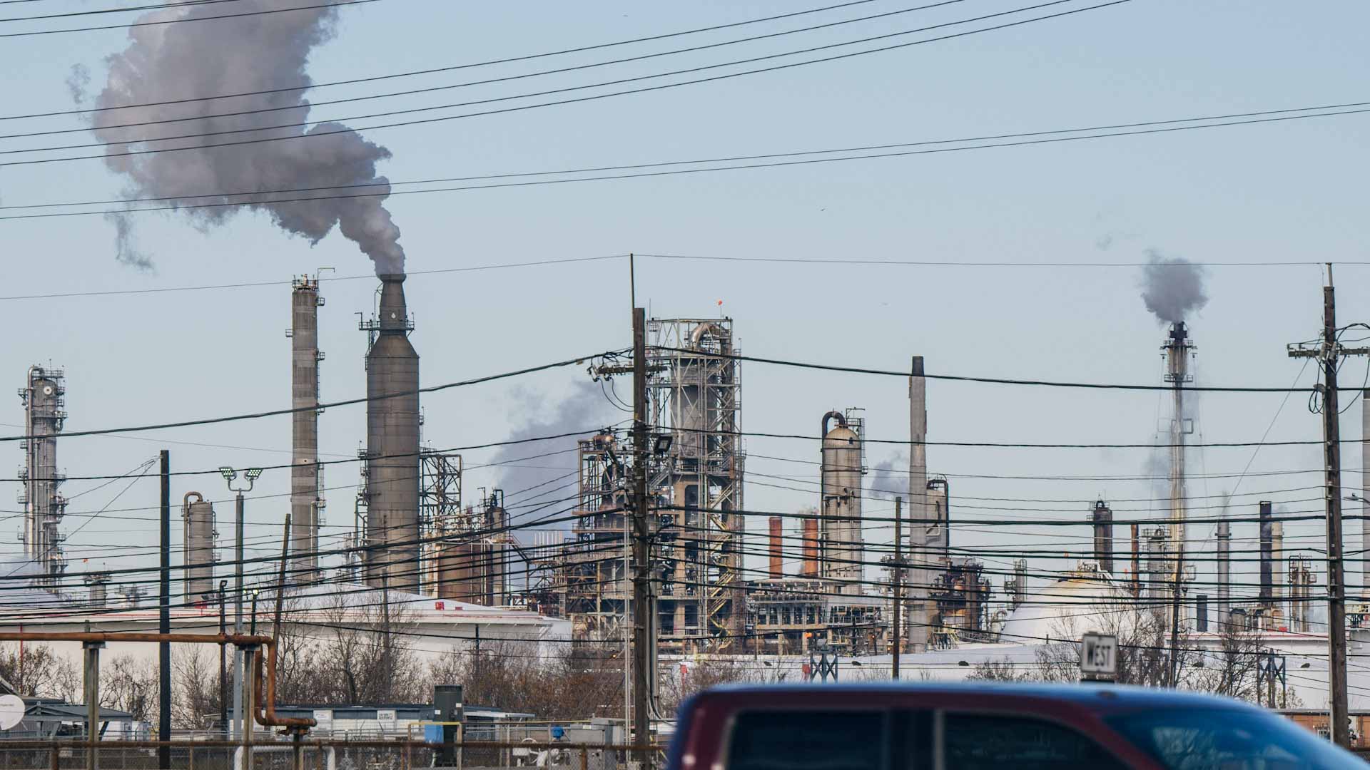 Image for the title: Oil prices mixed on easing COVID curbs in China, firm dollar 