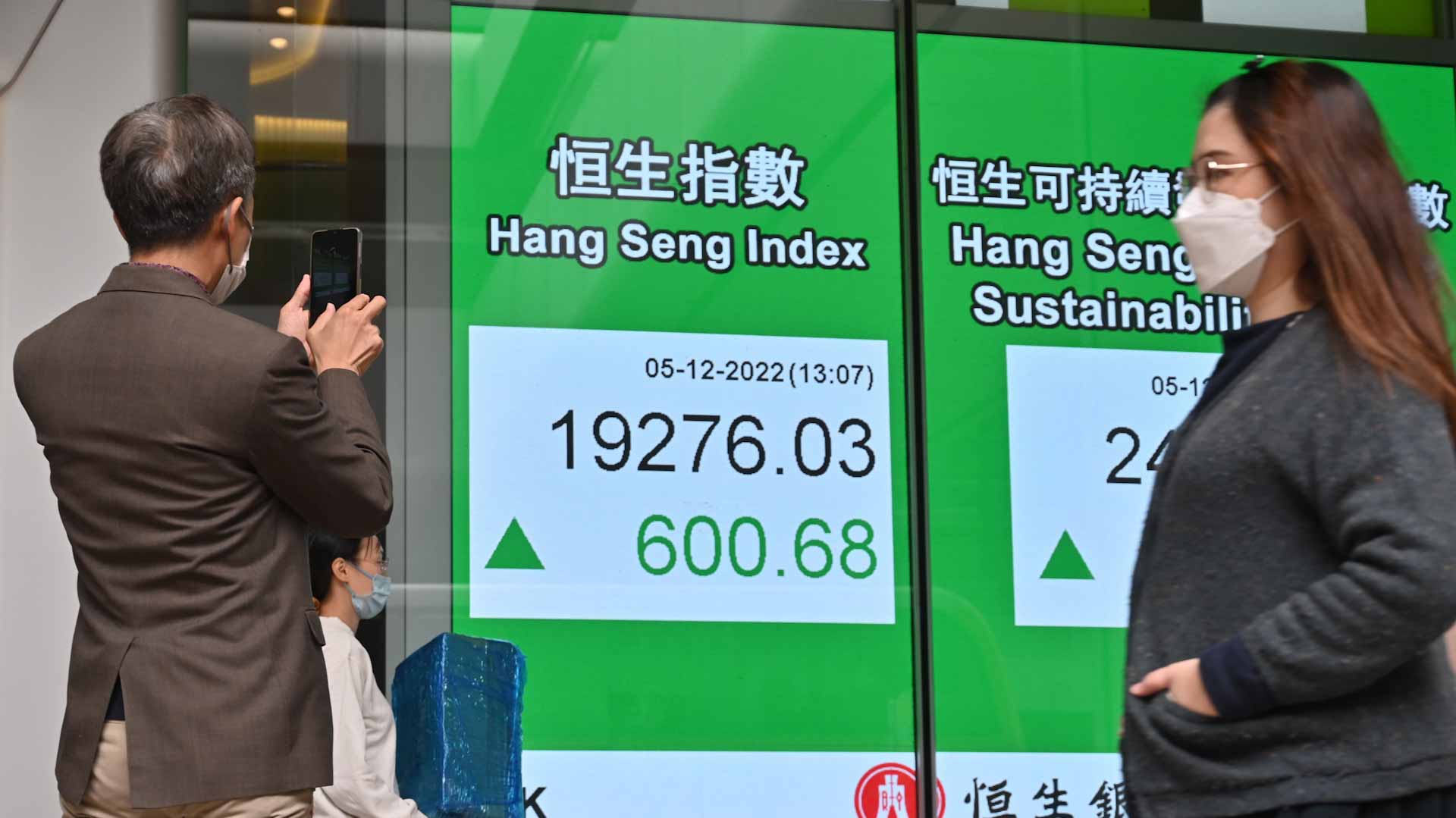 Image for the title: Stocks climb as China eases more Covid measures 