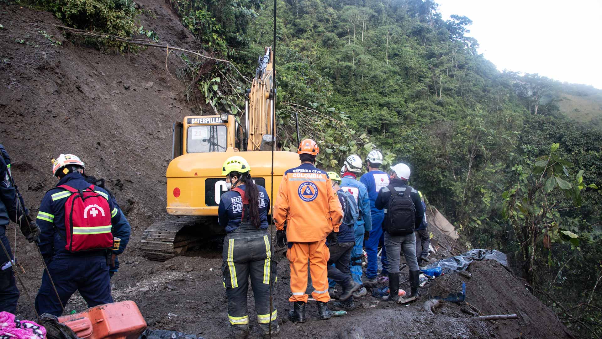 Image for the title: Landslide buries bus in Colombia, killing at least 34 