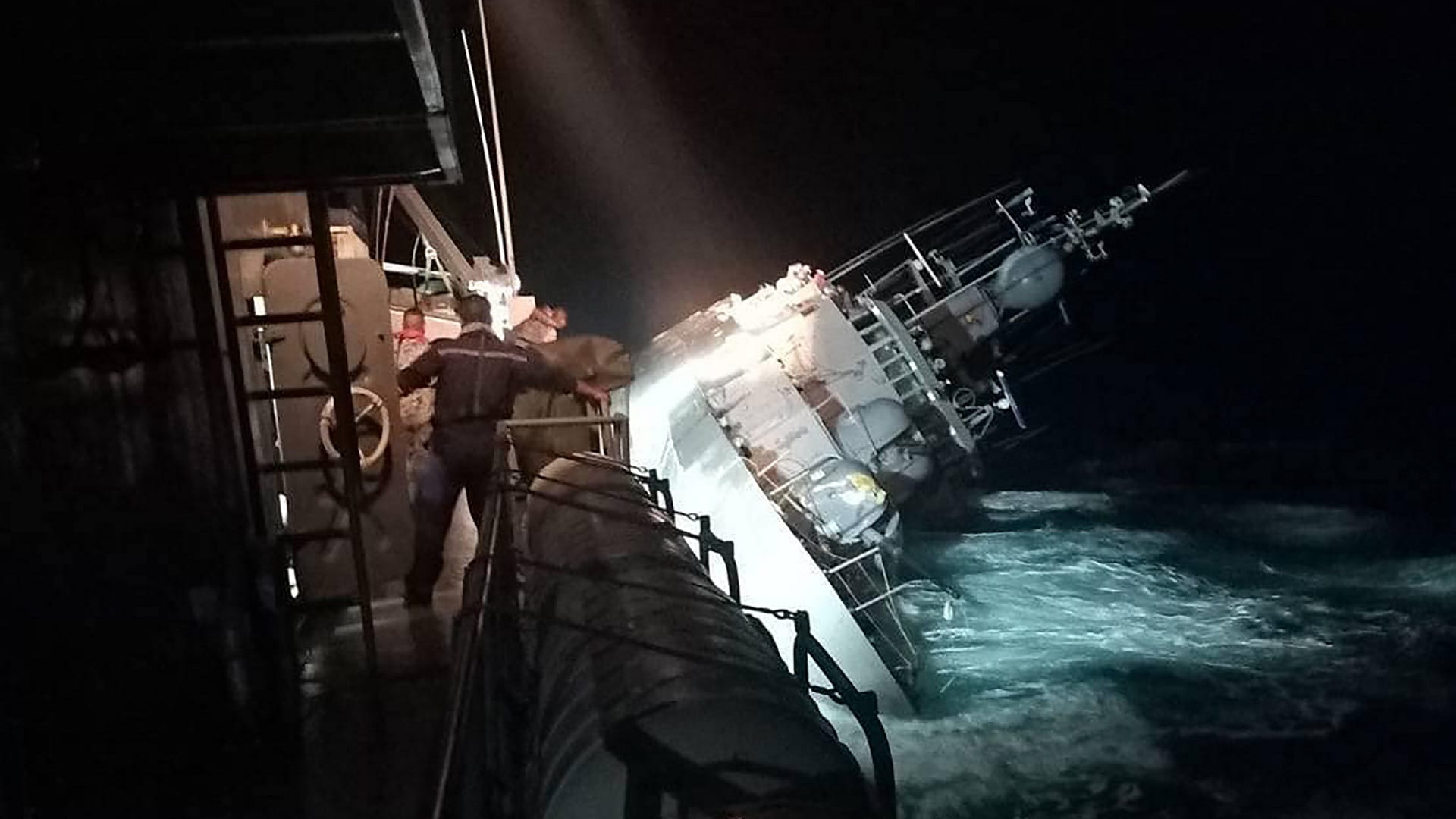 Image for the title: Thai navy searches for 31 sailors after vessel sinks 