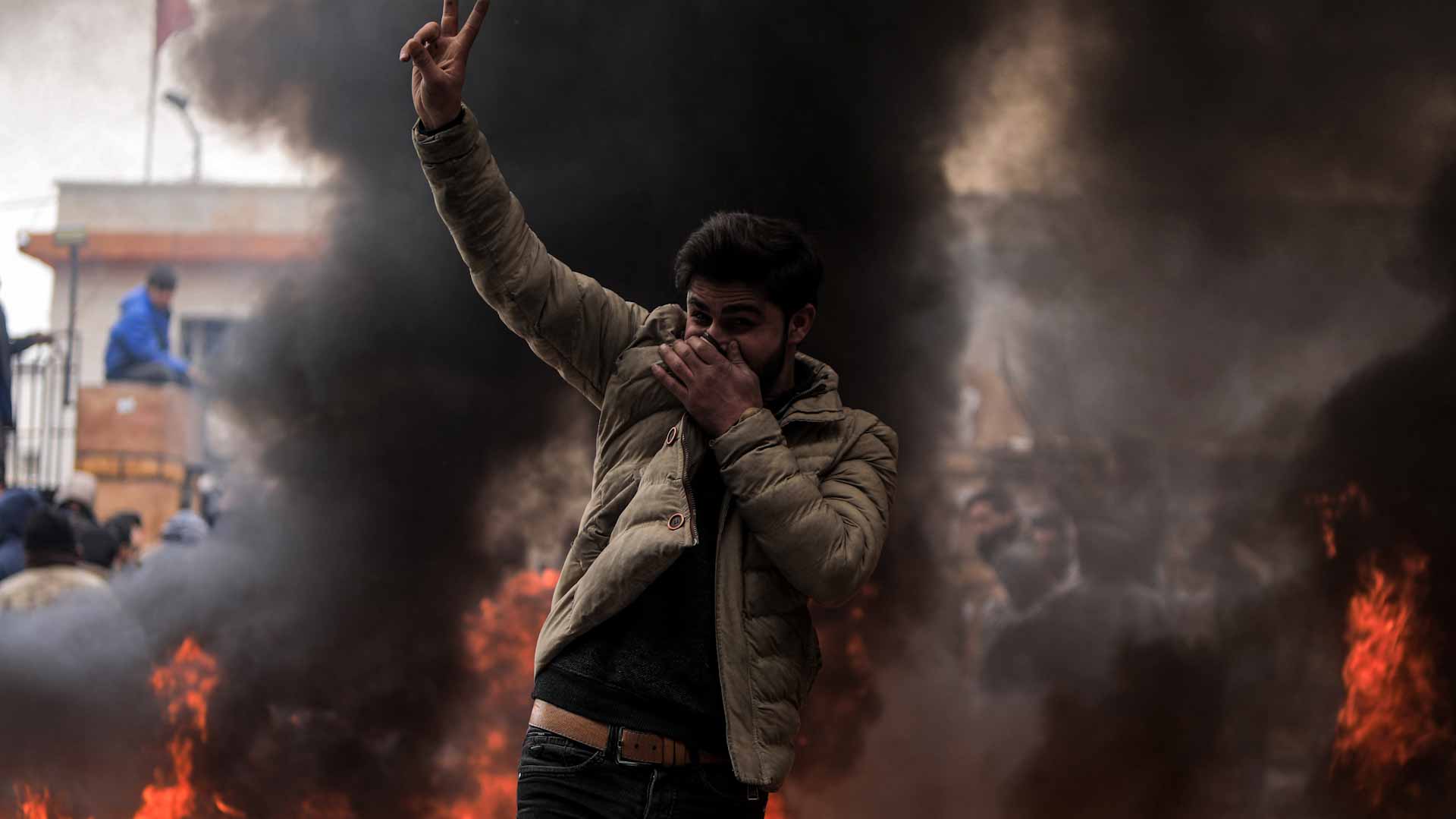 Image for the title: Hundreds rally in rare southern Syria protest 