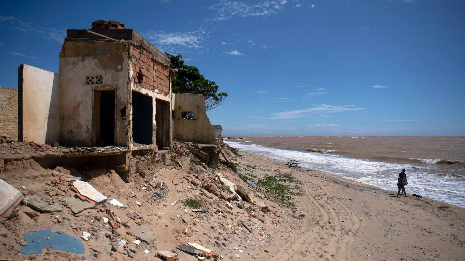 Image for the title: The Brazil resort town disappearing into the sea 