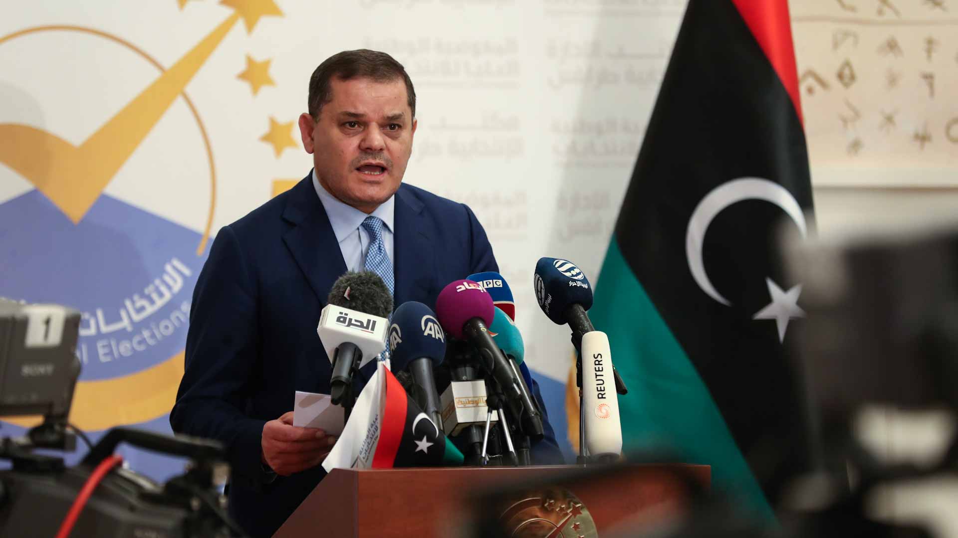 Image for the title: Libyan PM pushes summer election amid parliament bid to oust him 