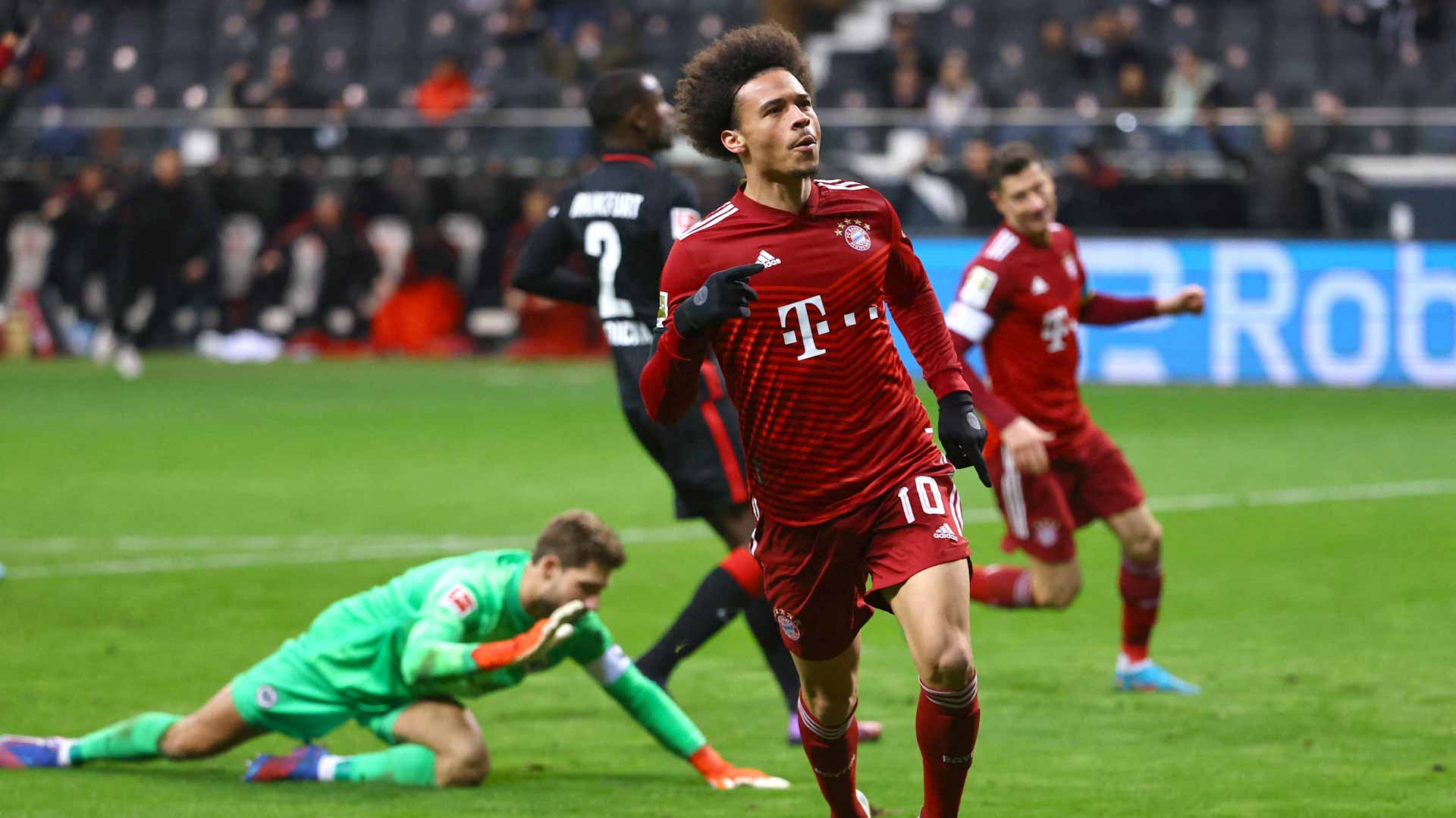Image for the title: Sane goals hands Bayern win at Frankfurt 