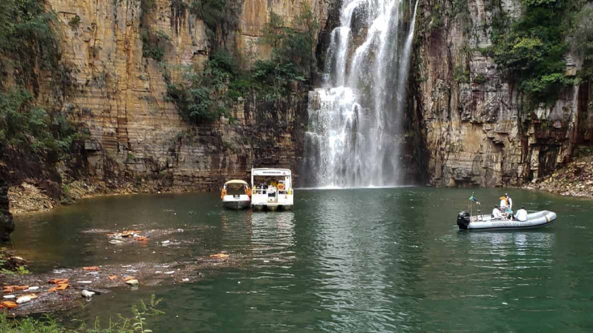 Image for the title: 7 dead, 3 missing after rock face collapse at Brazilian waterfall 