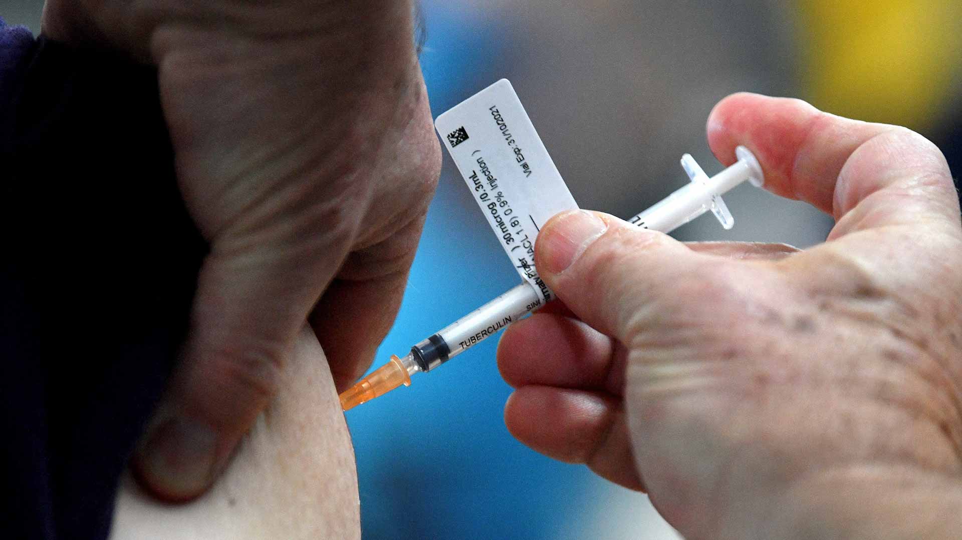 Image for the title: Australia Corona infections hit record amid Omicron outbreak