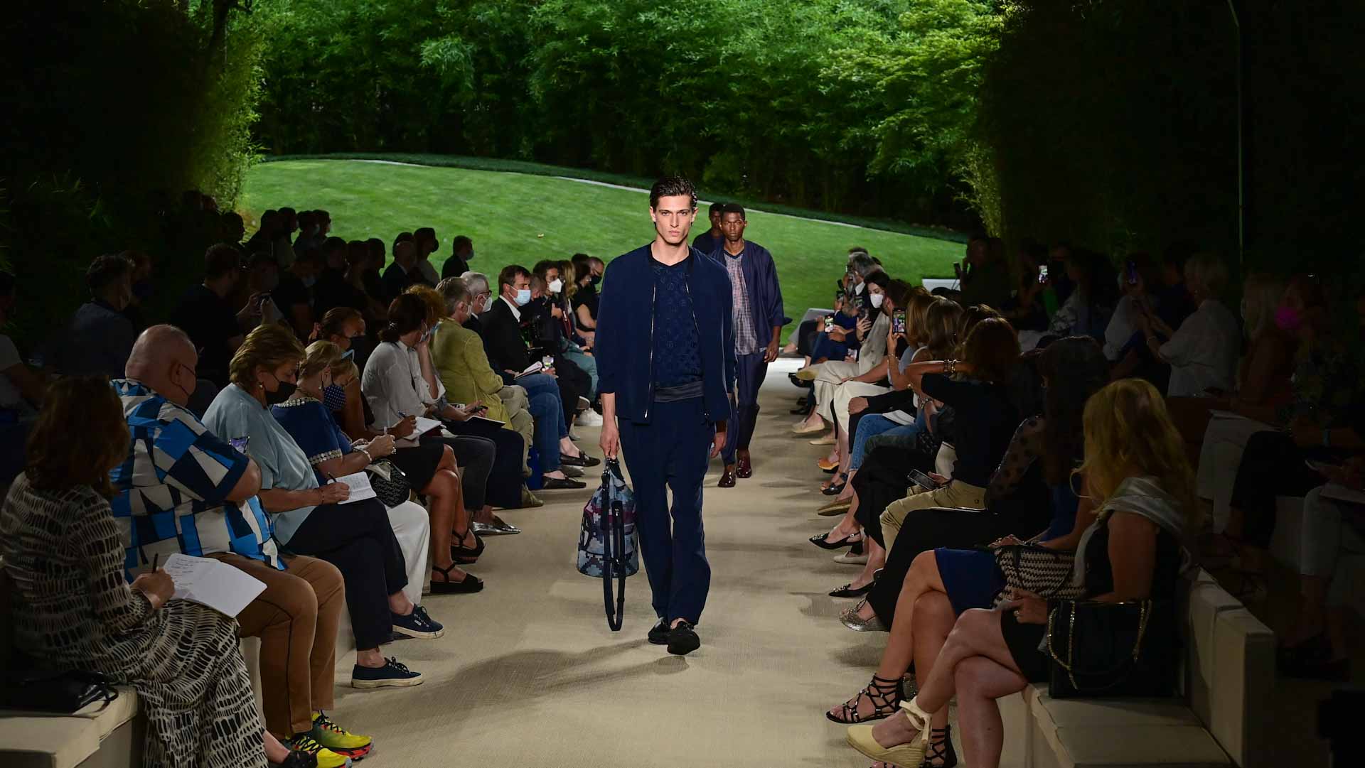 Image for the title: Covid bites but fashion keeps men warm in Milan 