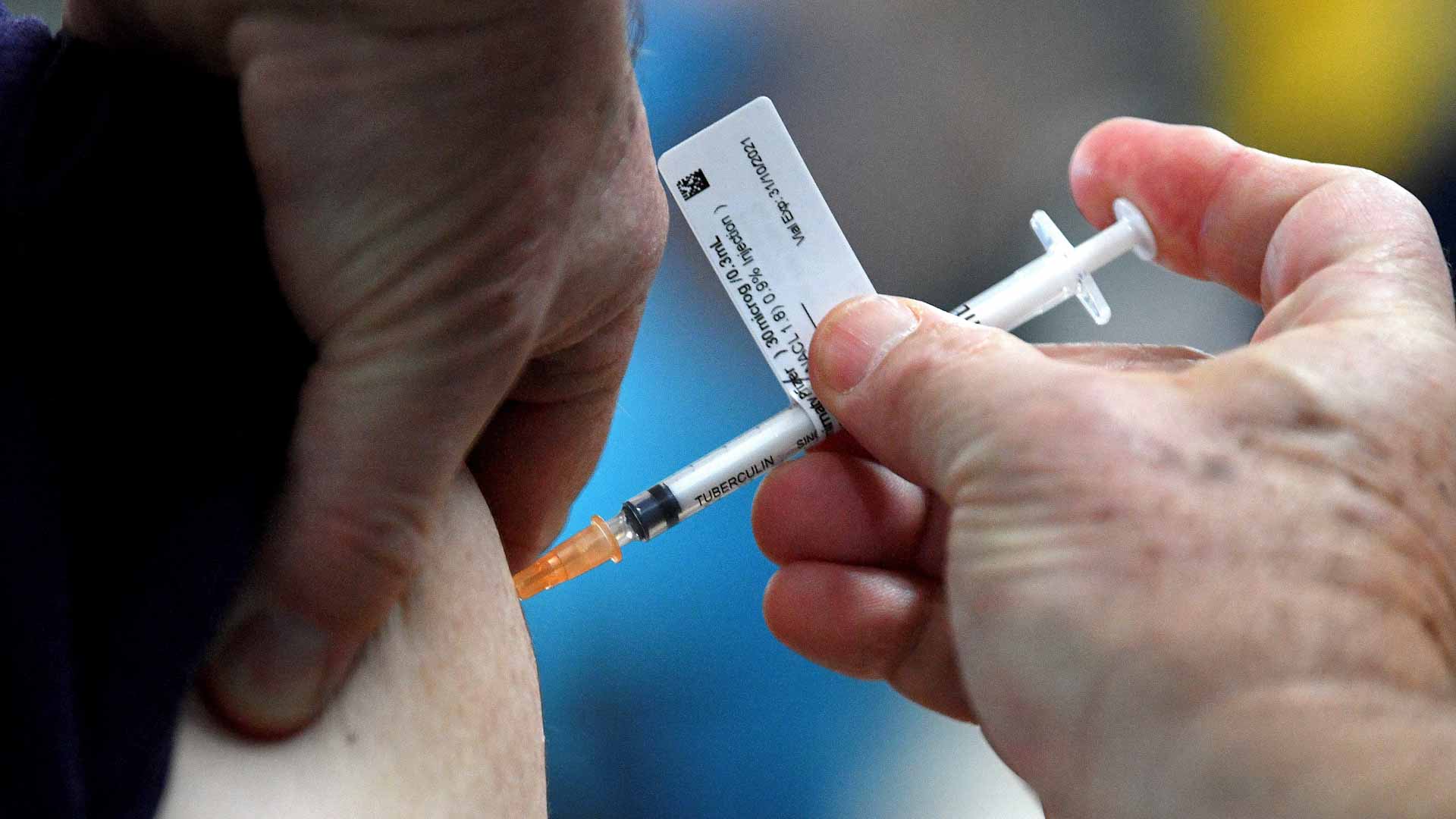 Image for the title: Australia virus deaths mount amid Omicron surge 