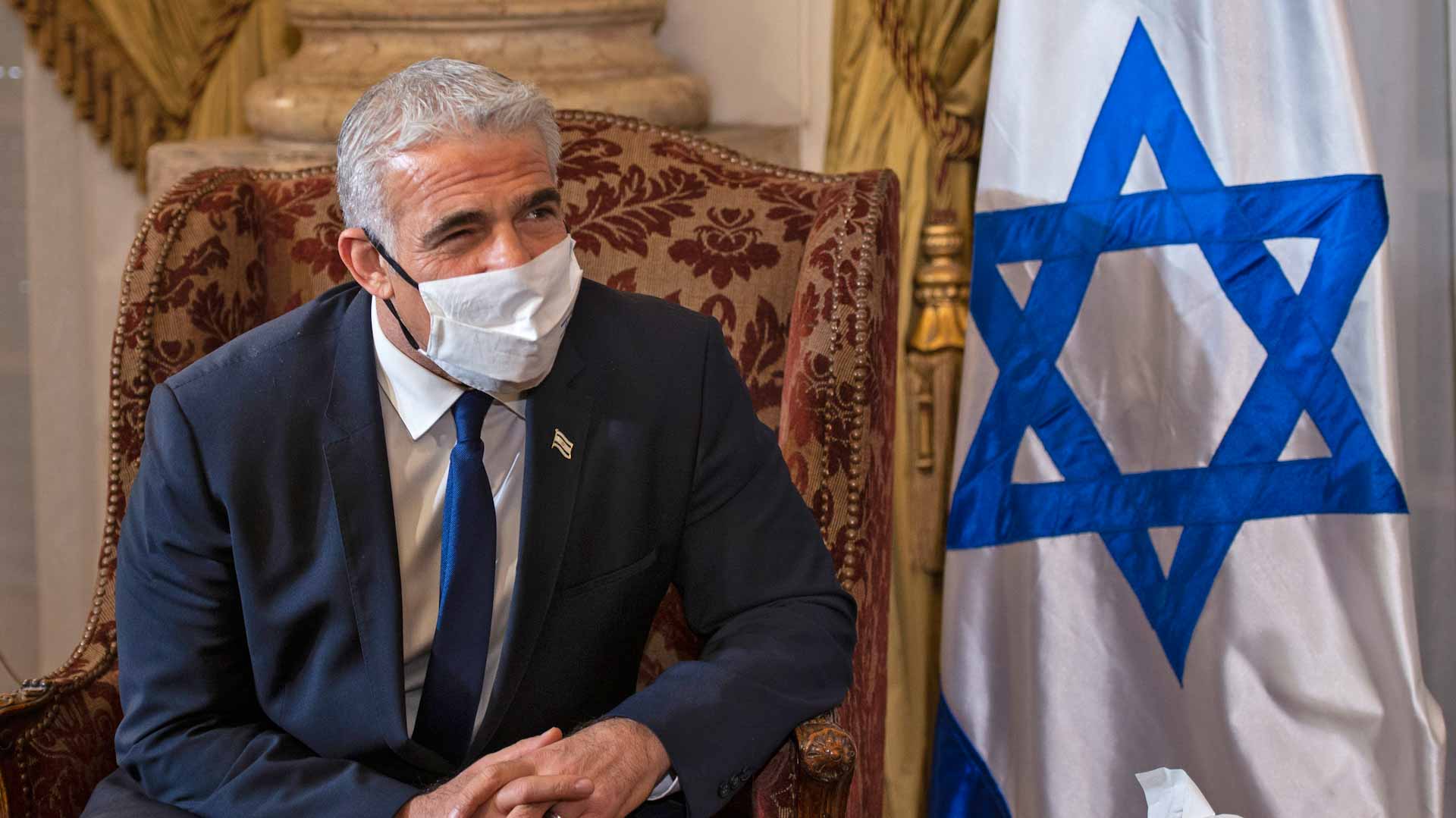 Image for the title: Palestinian minister says holds first meet with Israel's Lapid 