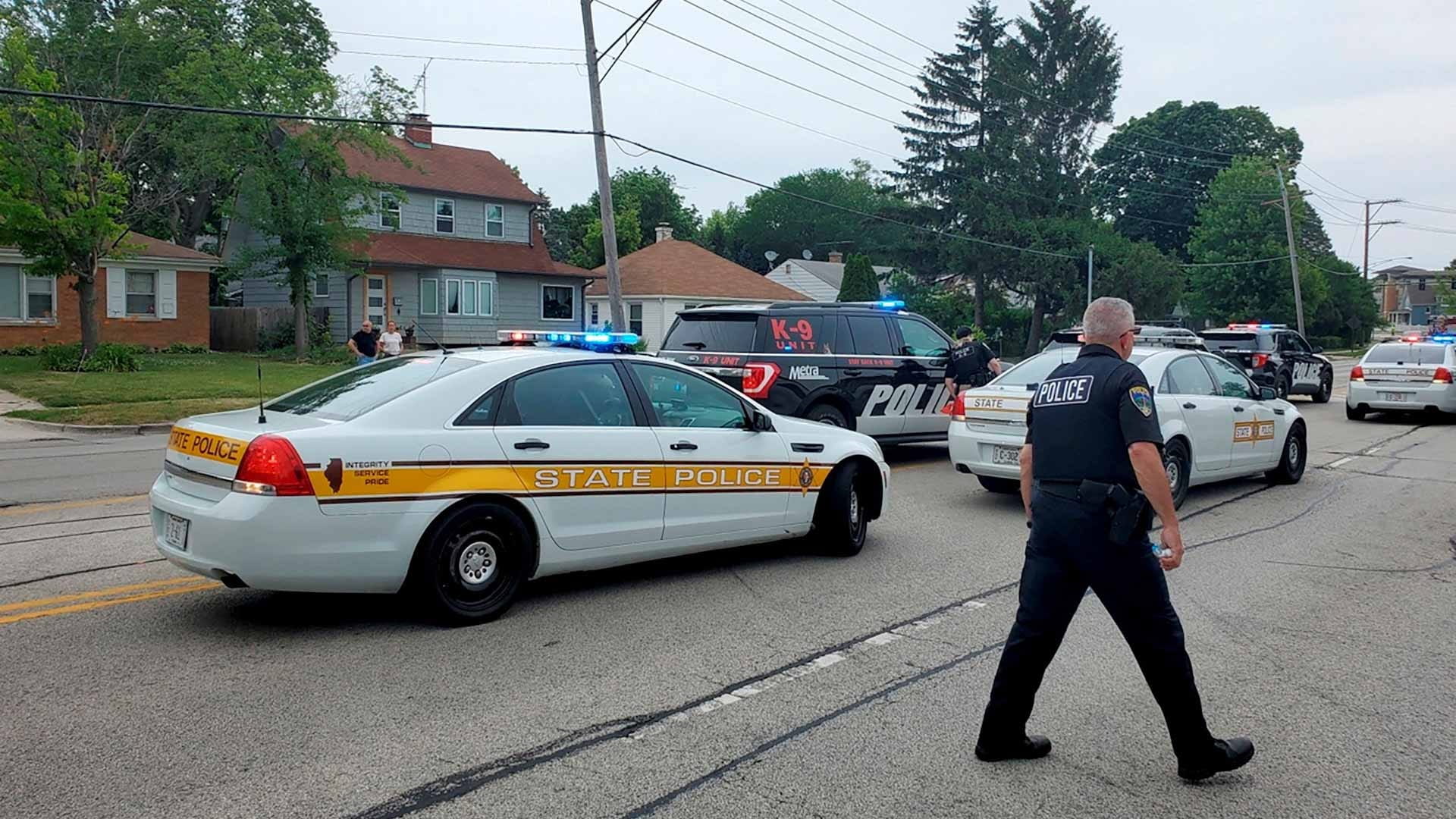 Image for the title: Police arrest suspect after gunman kills six at US July 4 parade 