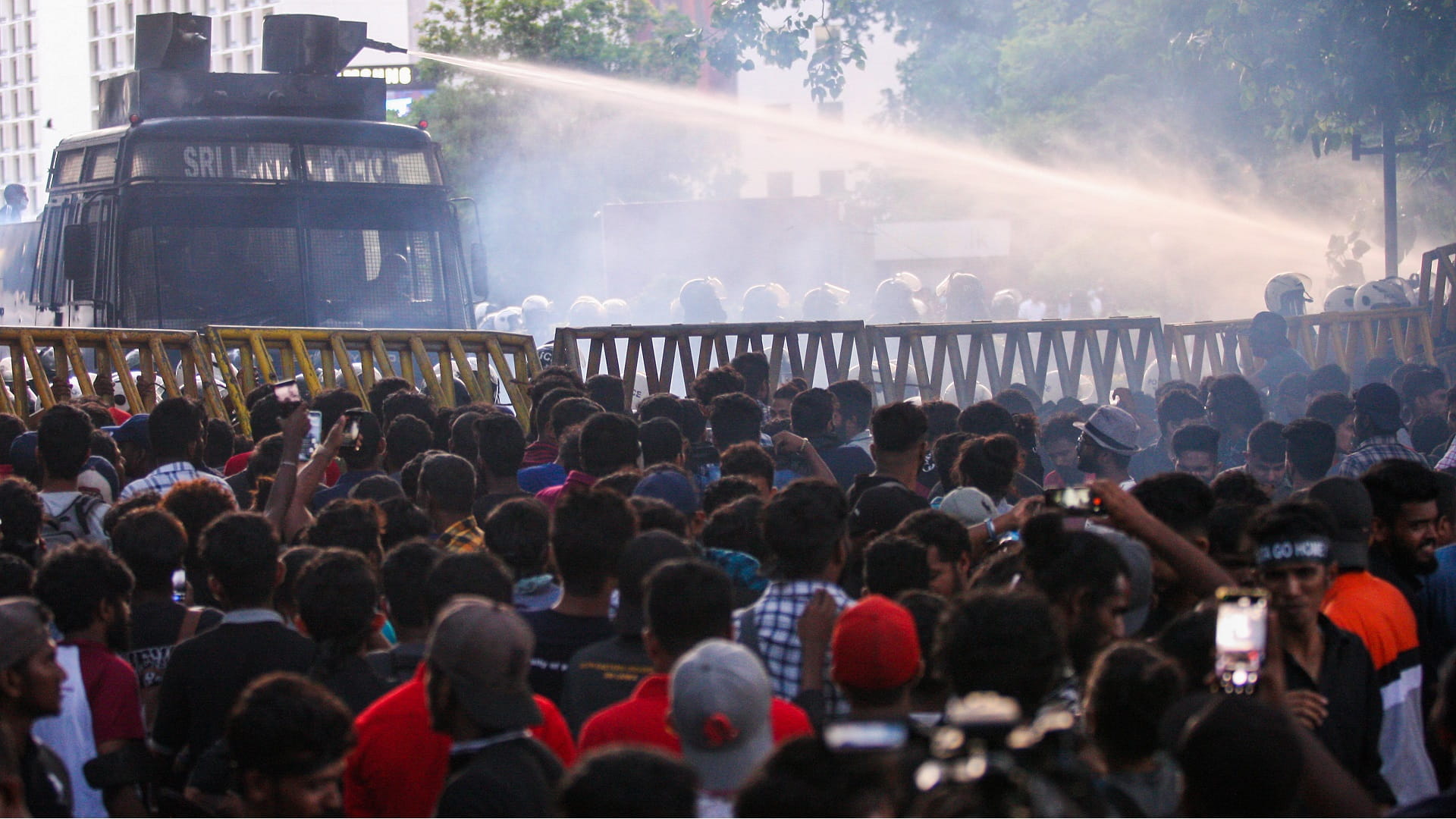 Image for the title: Sri Lanka leader flees as protesters storm home 