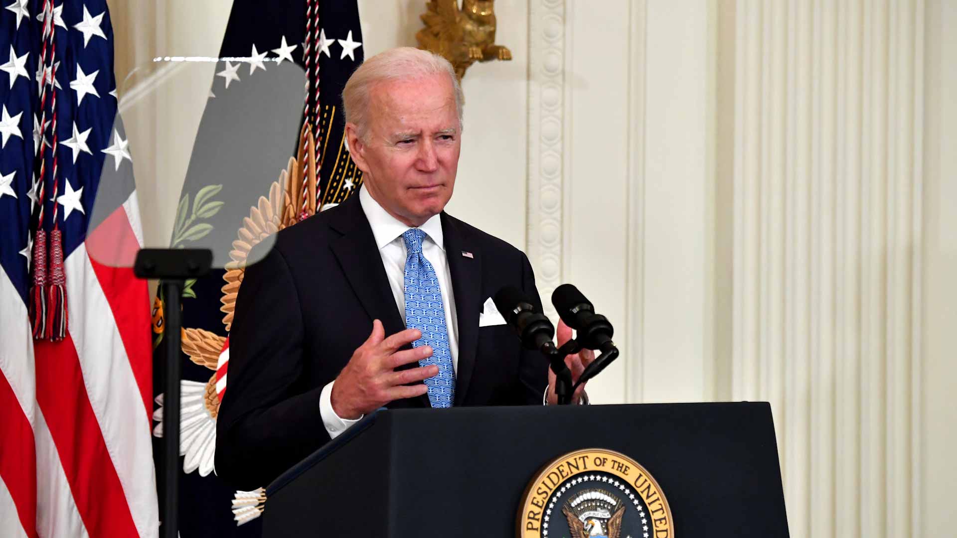 Image for the title: Biden to use executive action to spur solar projects hit by probe  