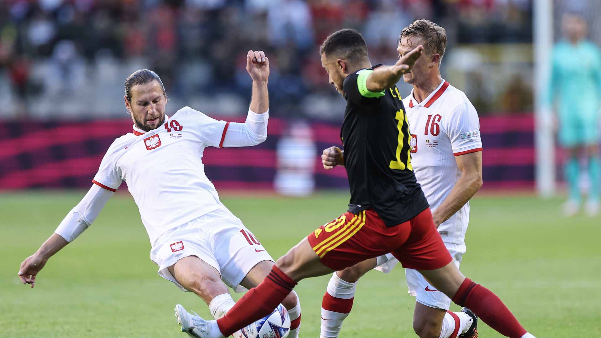 Image for the title: Belgium bounce back to crush Poland 
