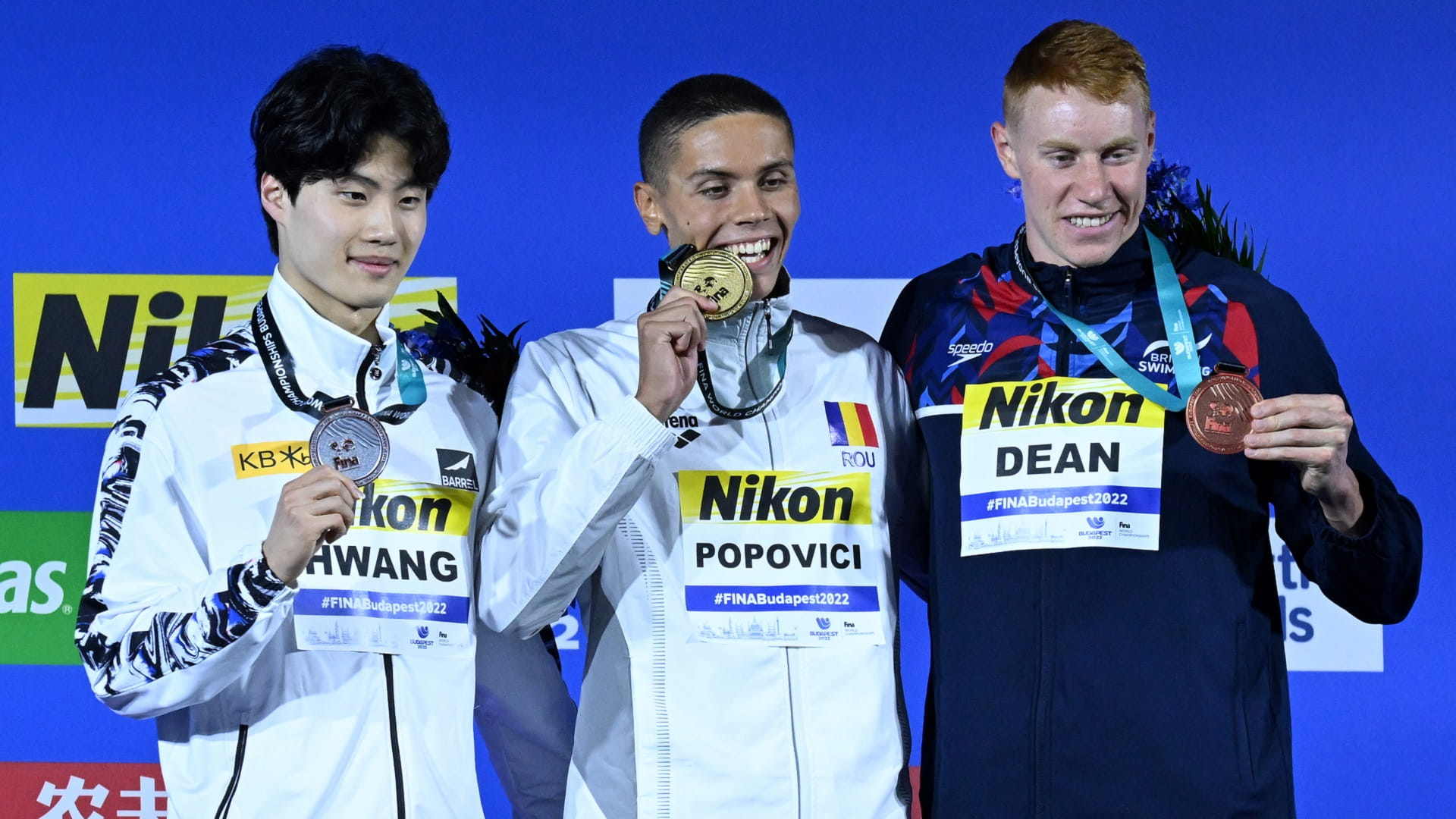 Image for the title: Youngster Popovici, veteran Ledecky take glory in swimming worlds 