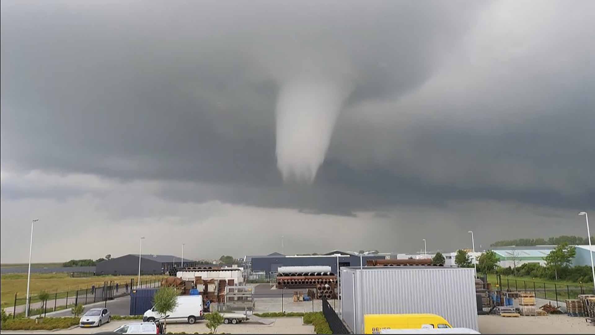 Image for the title: One dead as rare tornado tears through Dutch city 