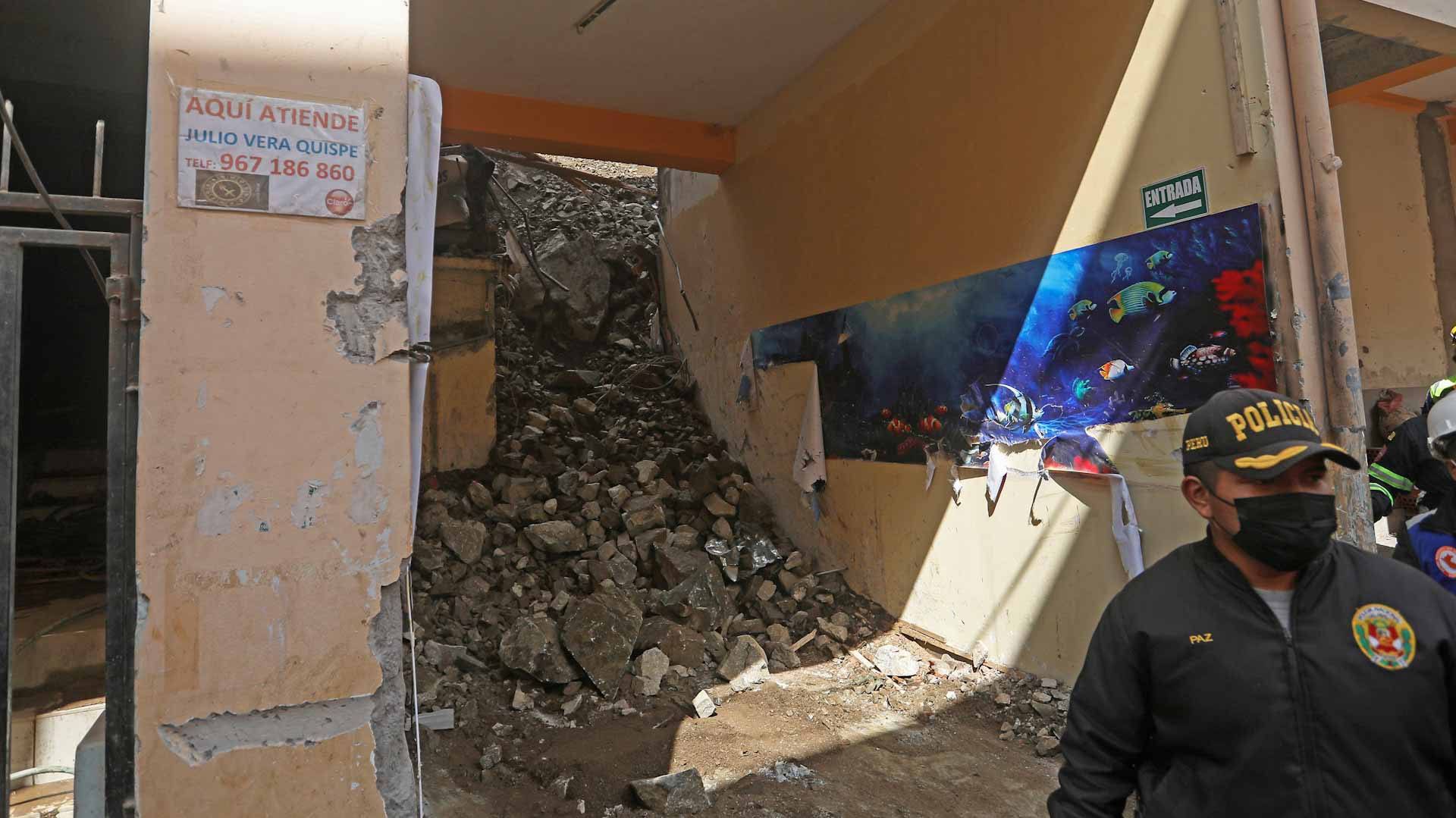 Image for the title: Rescuers find two dead bodies after Peru landslide 