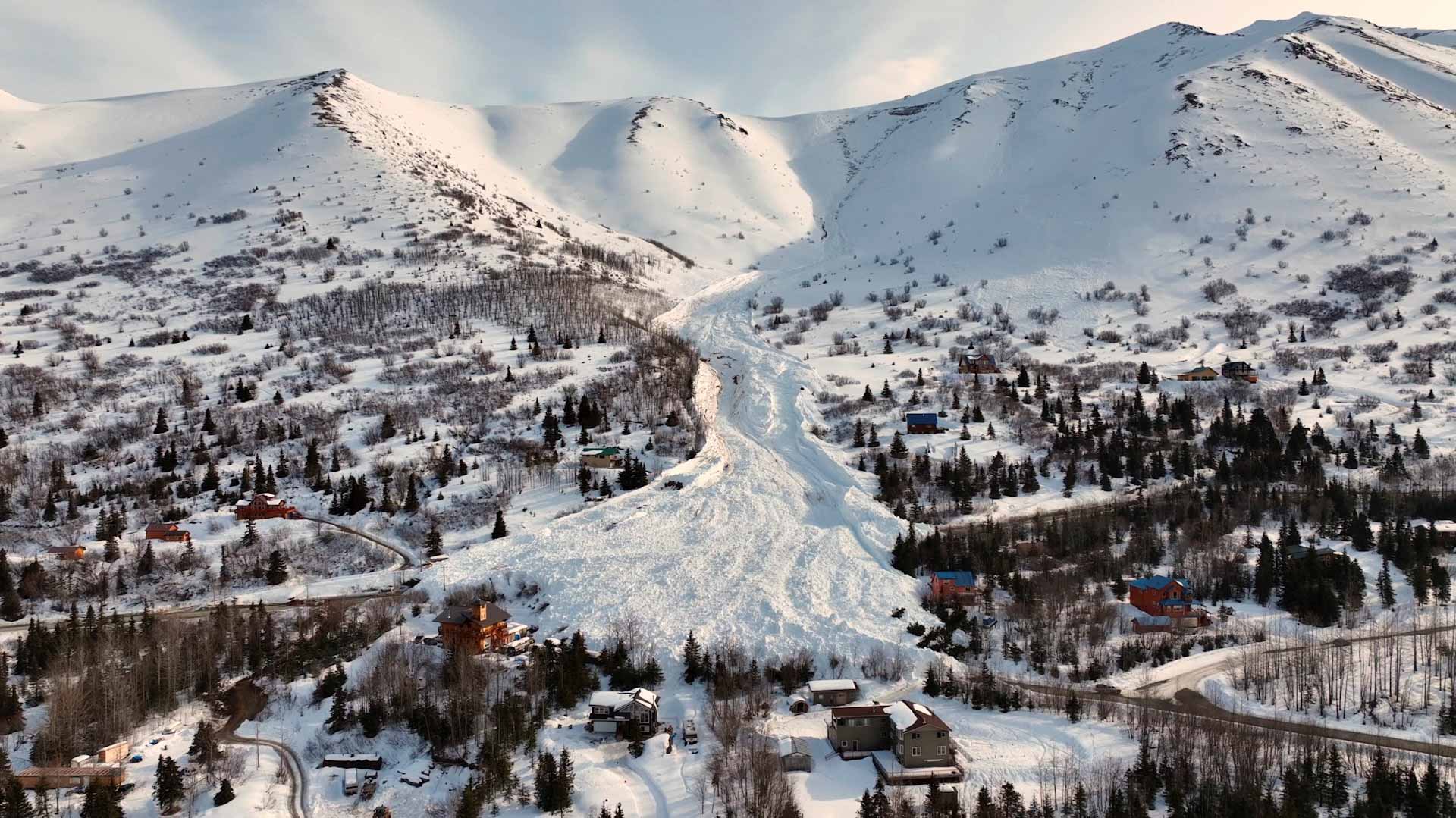 Image for the title: Drone footage of Alaska avalanche shows buried mountainside 