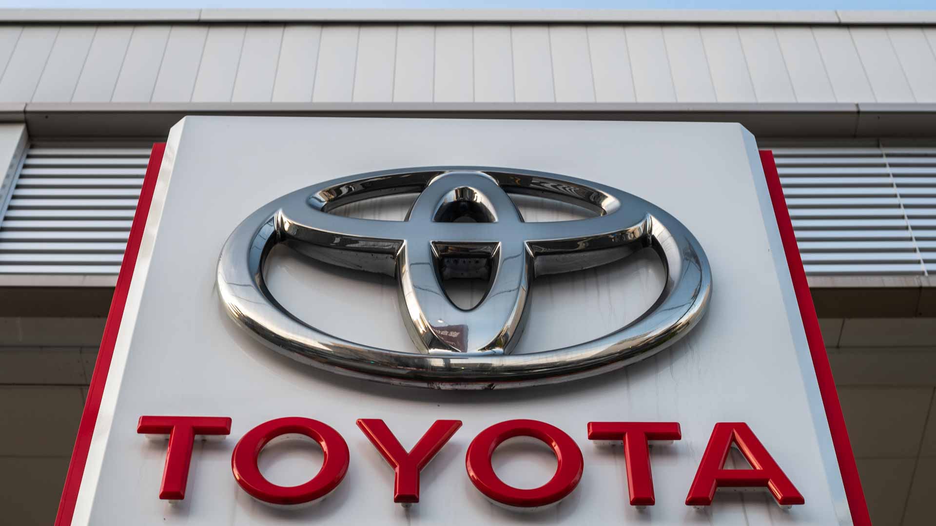 Image for the title: Toyota posts record full-year net profit, forecasts cautious 