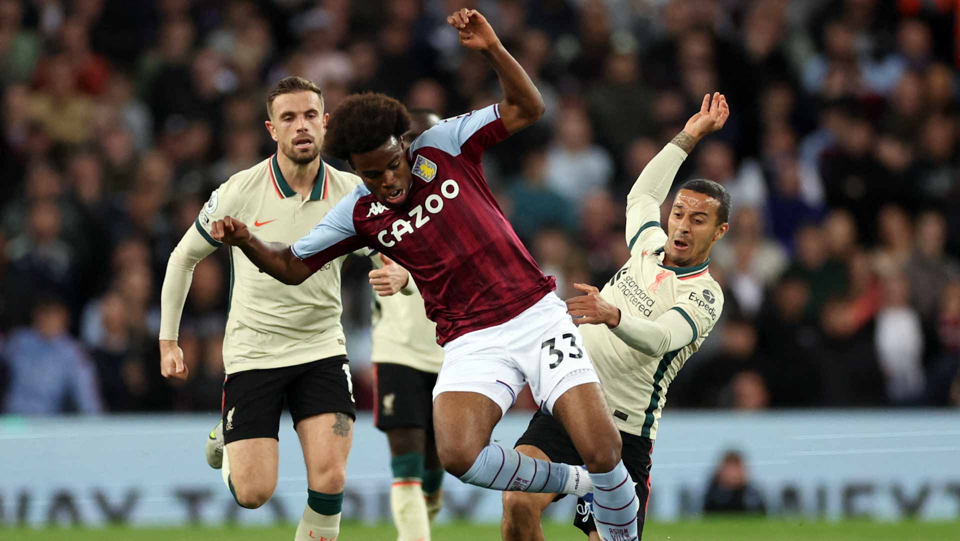 Image for the title: Liverpool stay in title hunt with Villa win 