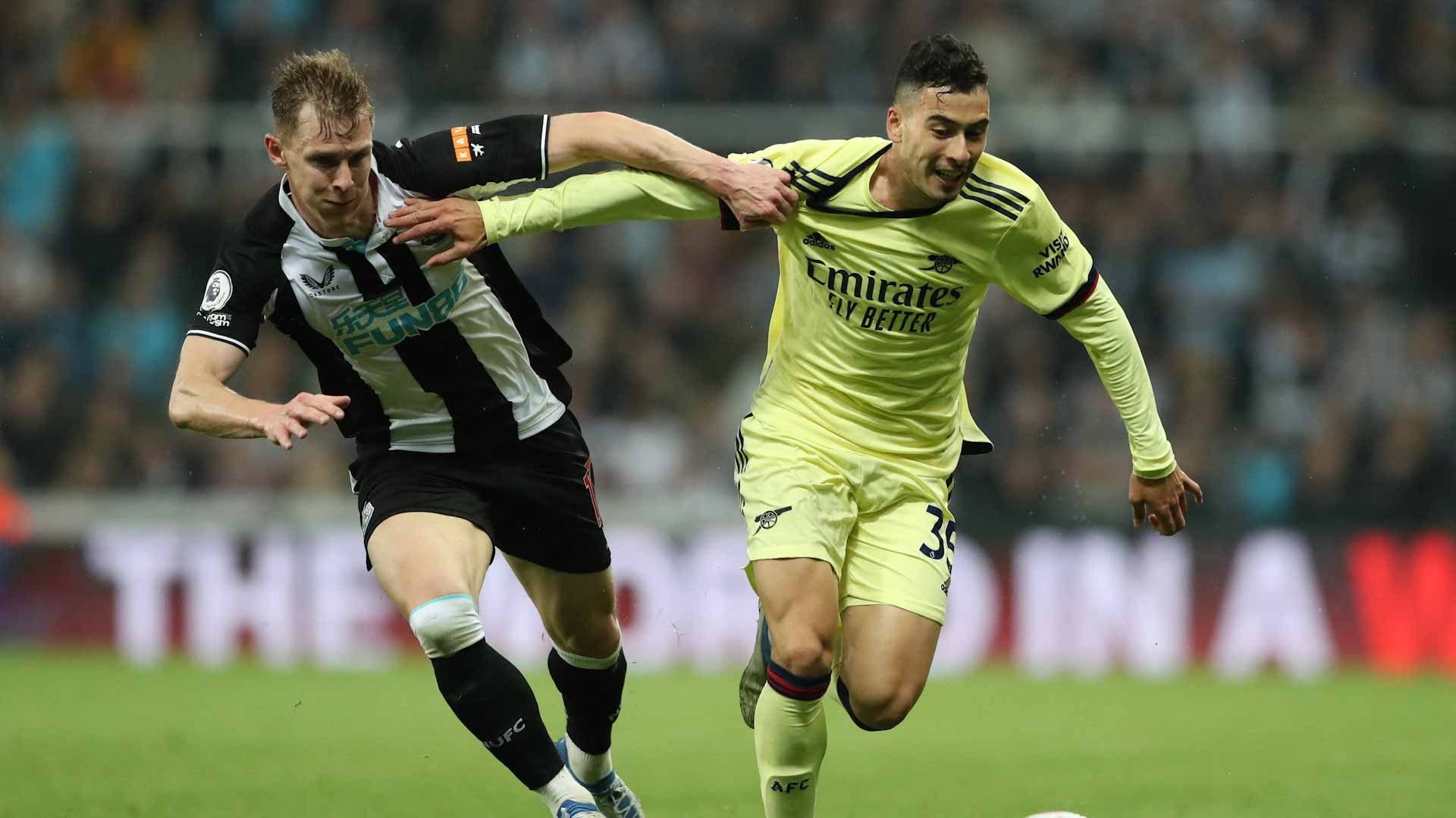 Image for the title: Arsenal falter in Champions League race with defeat by Newcastle 