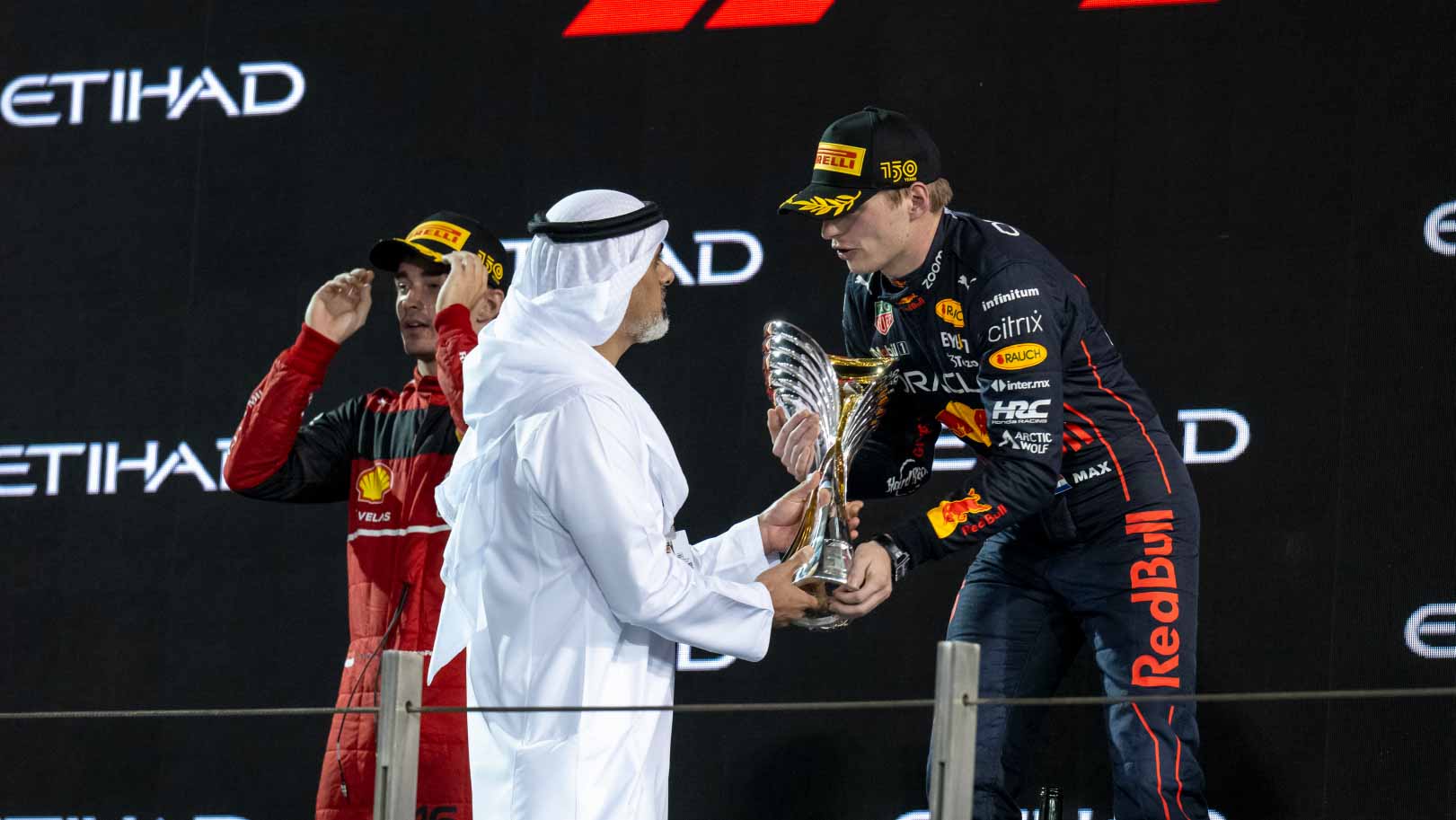Image for the title: Khaled bin Mohamed presents winner’s trophy of Formula 1 AD GP 