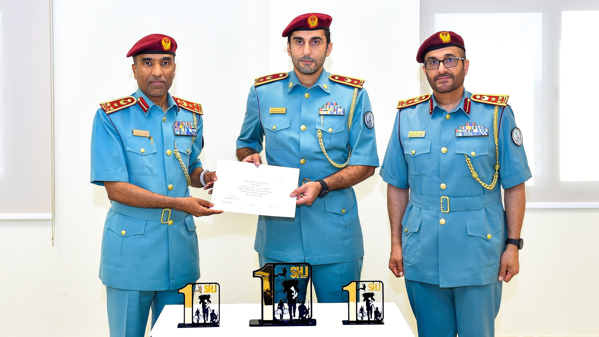 Image for the title: Al Sharif honours police officer's shooting prowess 