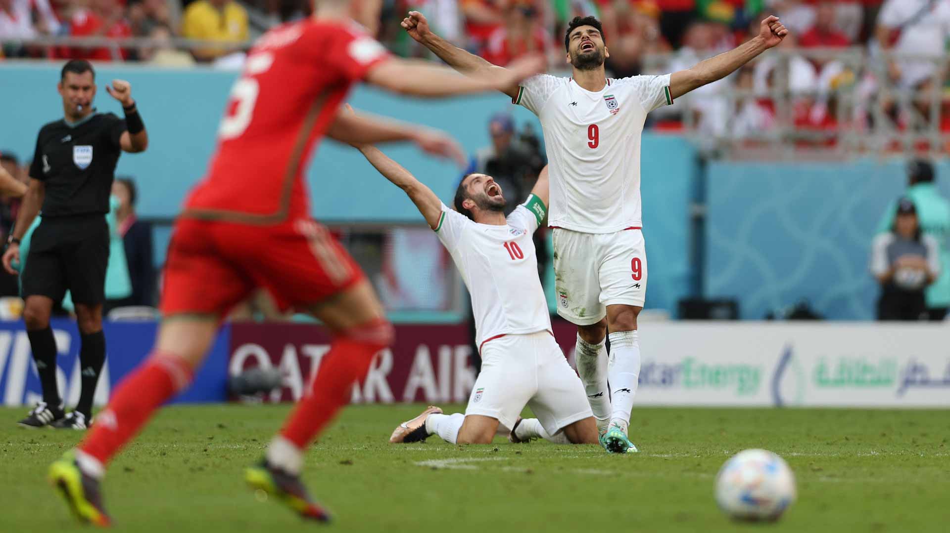 Image for the title: Iran shocks Wales at World Cup as England target last 16 