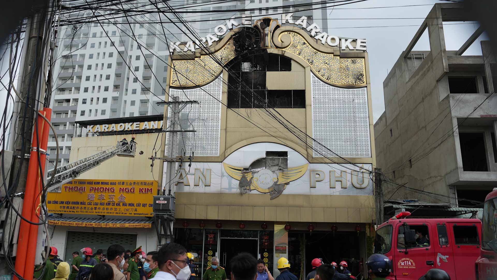 Image for the title: Two police officers arrested in Vietnam after blaze killed 32 