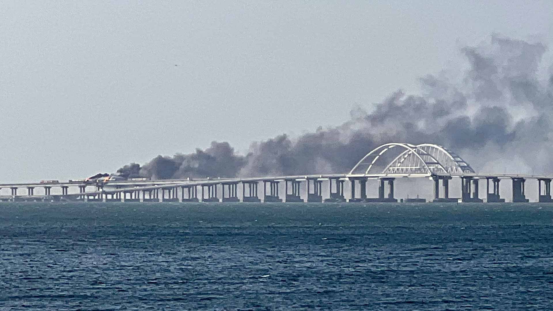 Image for the title: Crimea bridge resumes traffic after blast, Russian army changed 