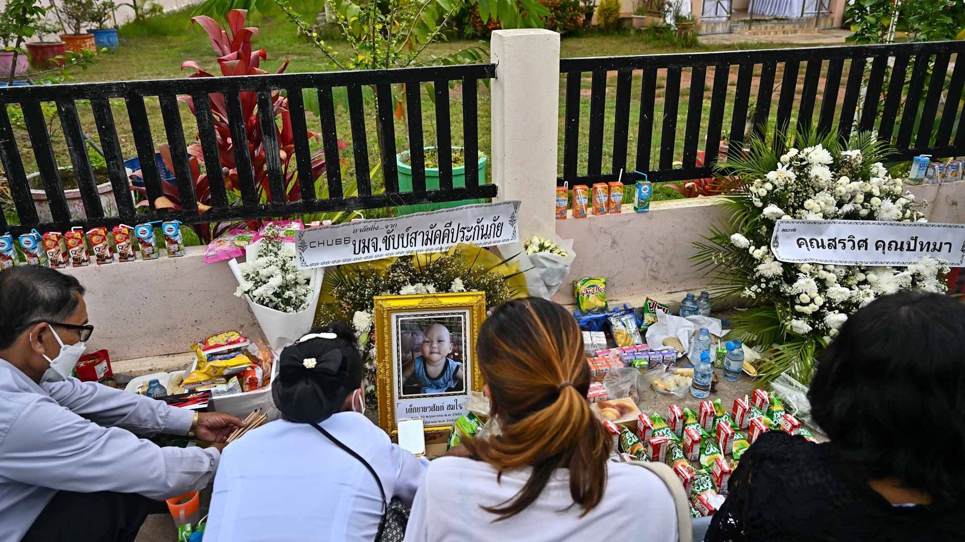 Image for the title: Thai nursery massacre families pray to free children's souls 