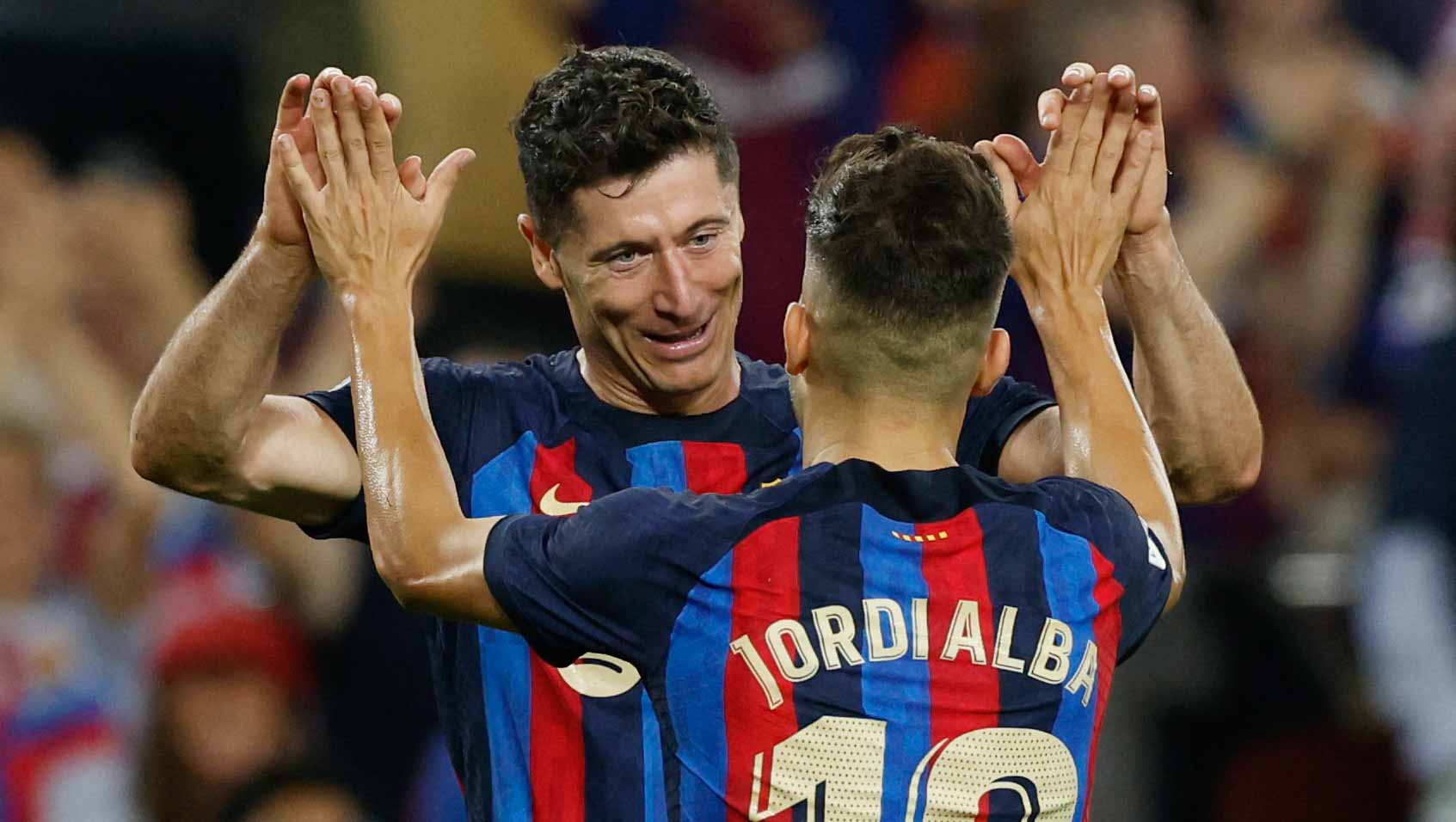 Image for the title: Lewandowski double as Barcelona ease past Villarreal 
