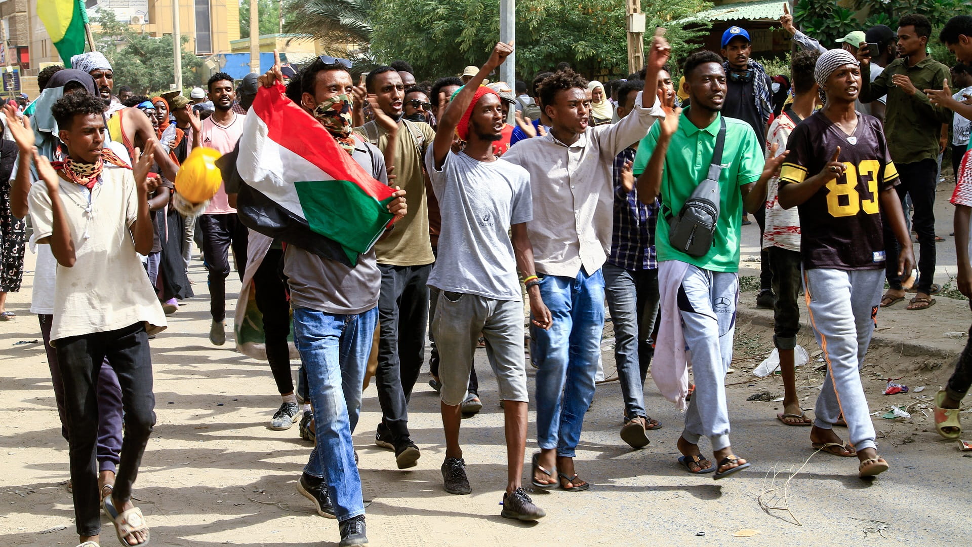 Image for the title: Sudanese take to streets to renew protests against military coup 
