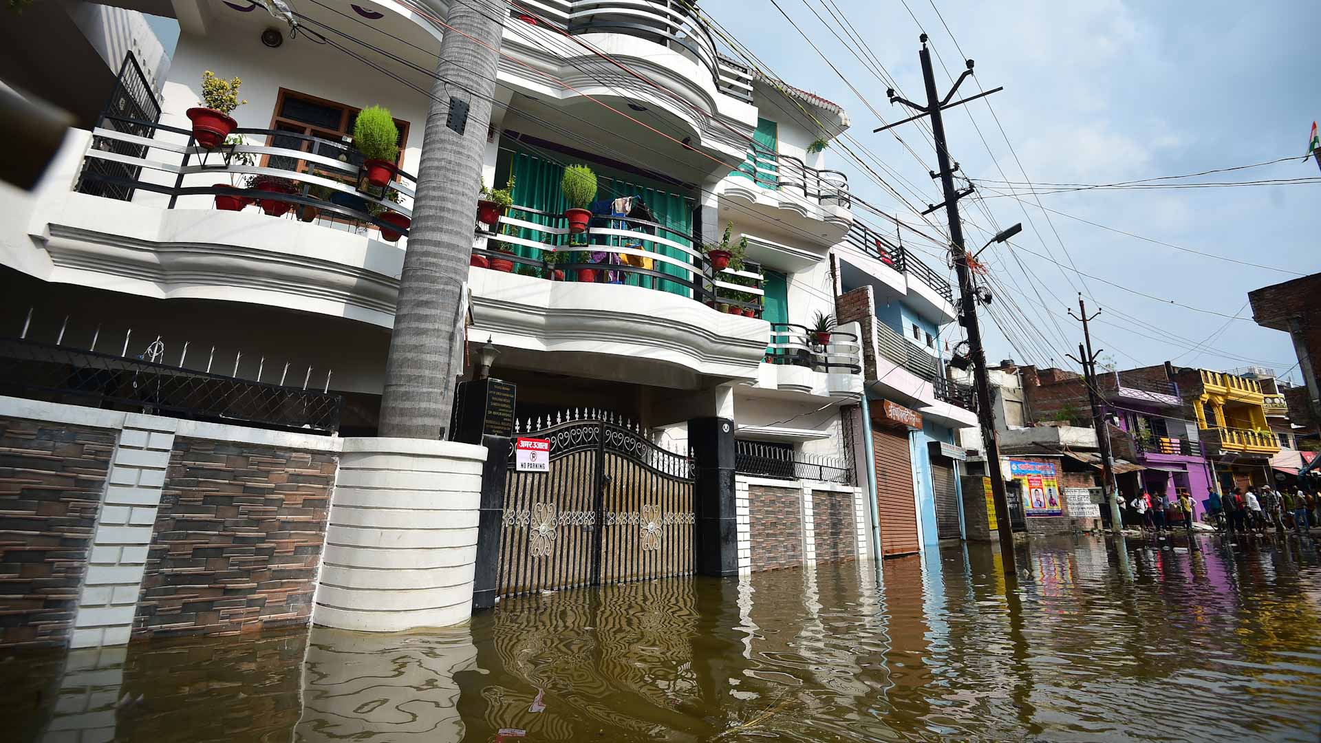 Image for the title: India's Bengaluru hit by flooding, traffic snarls after heavy rain 