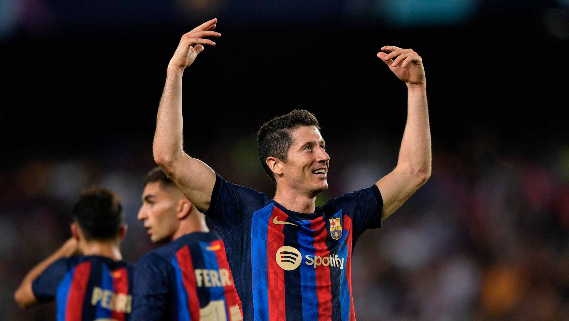 Image for the title: Lewandowski bags hat-trick in Barca Champions League bow 
