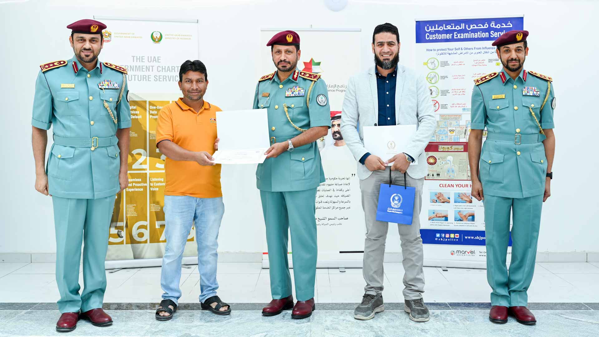 Image for the title: Al Shamsi honours two persons for saving child's life  