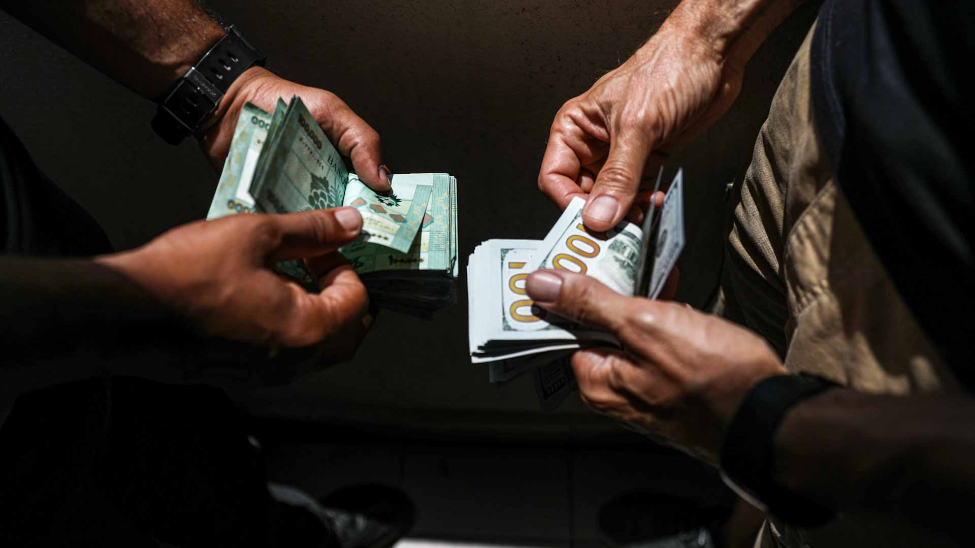 Image for the title: Lebanese currency hits record low amid bank closures 