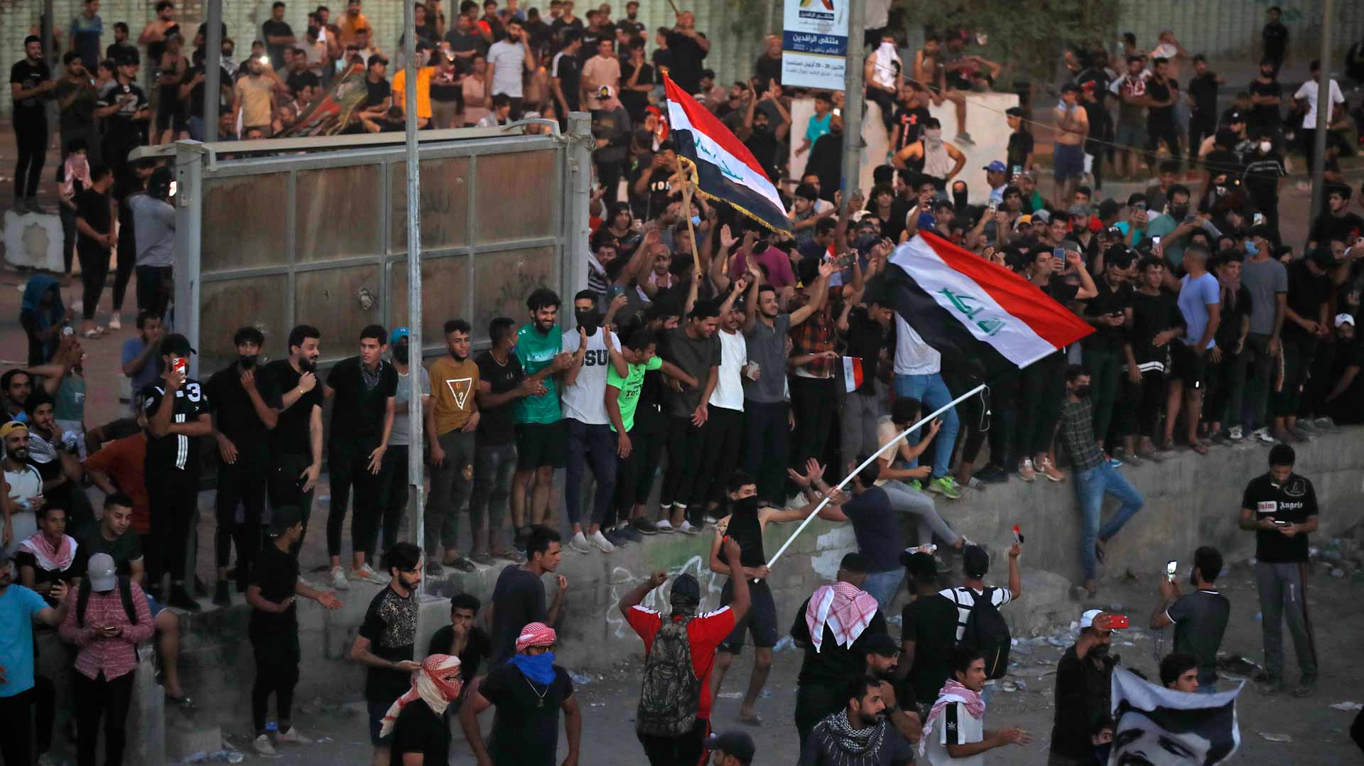 Image for the title: Thousands of Iraqis mark third anniversary of nationwide protests 