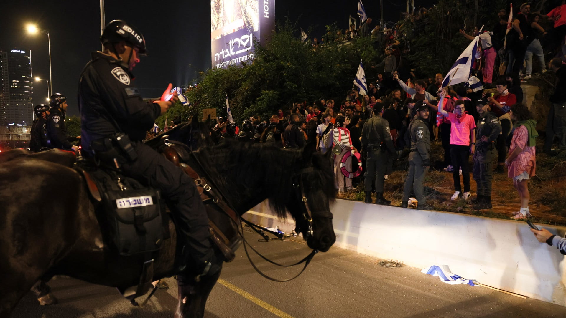 Image for the title: Israeli judicial protest movement again crowds Tel Aviv 