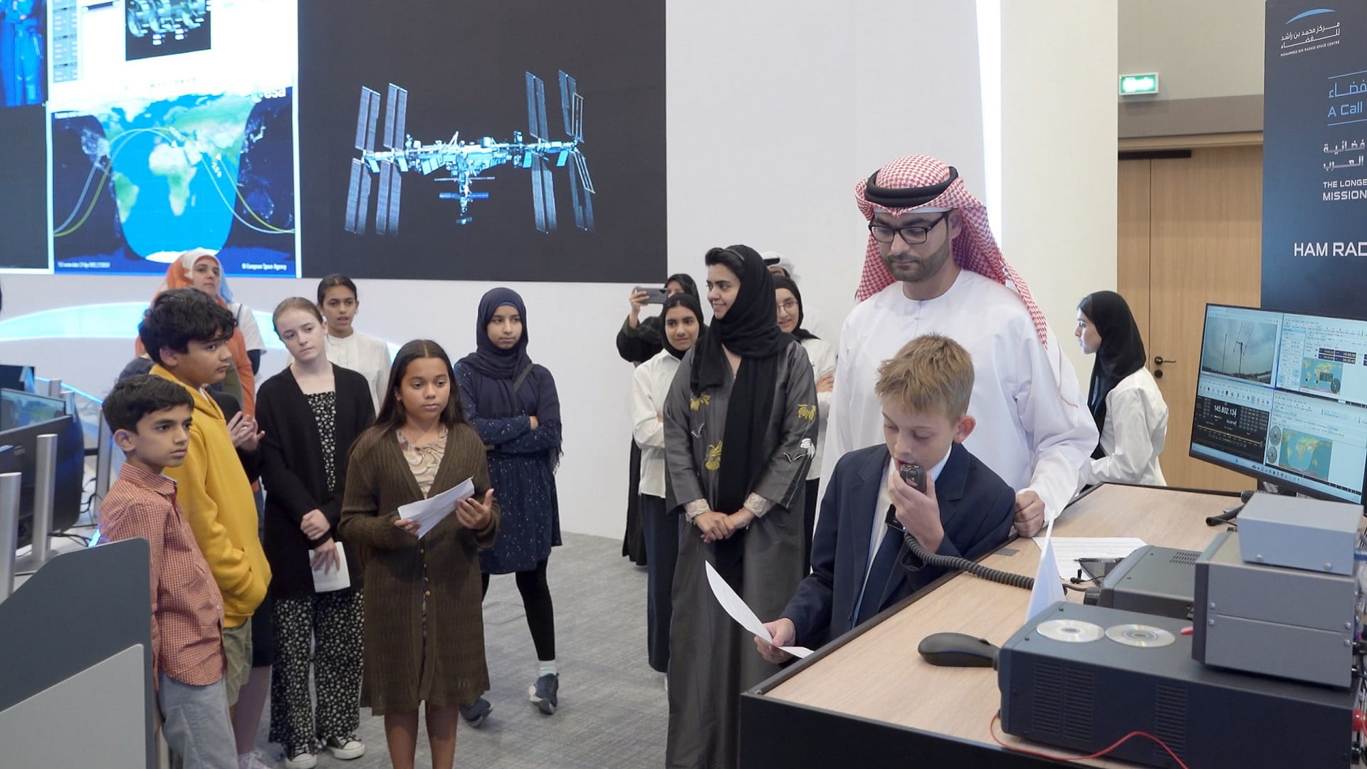 Image for the title: AlNeyadi interacts with students during radio session from ISS 