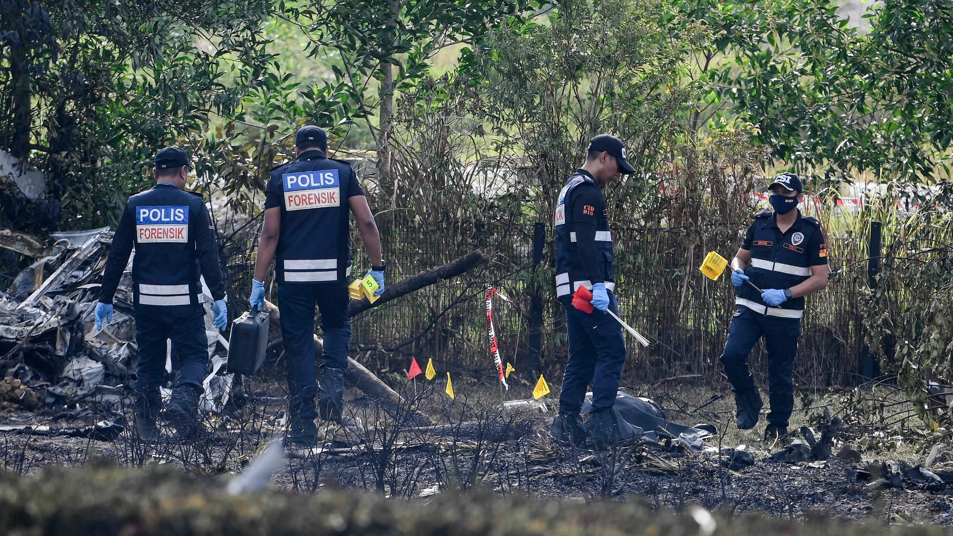 Image for the title: 10 killed in light plane crash on street in Malaysia 