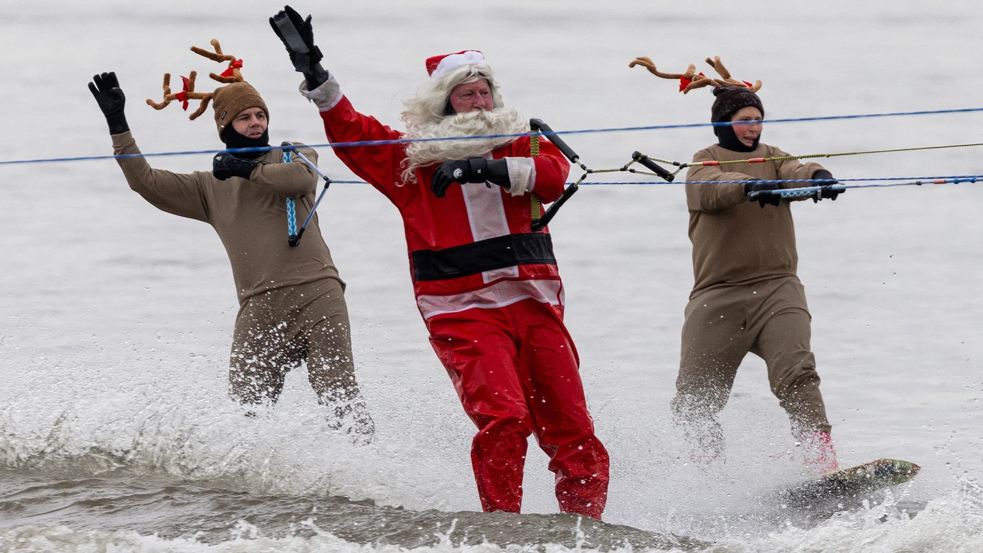 Image for the title: Surfing Santas ride waves, raise funds in Florida 