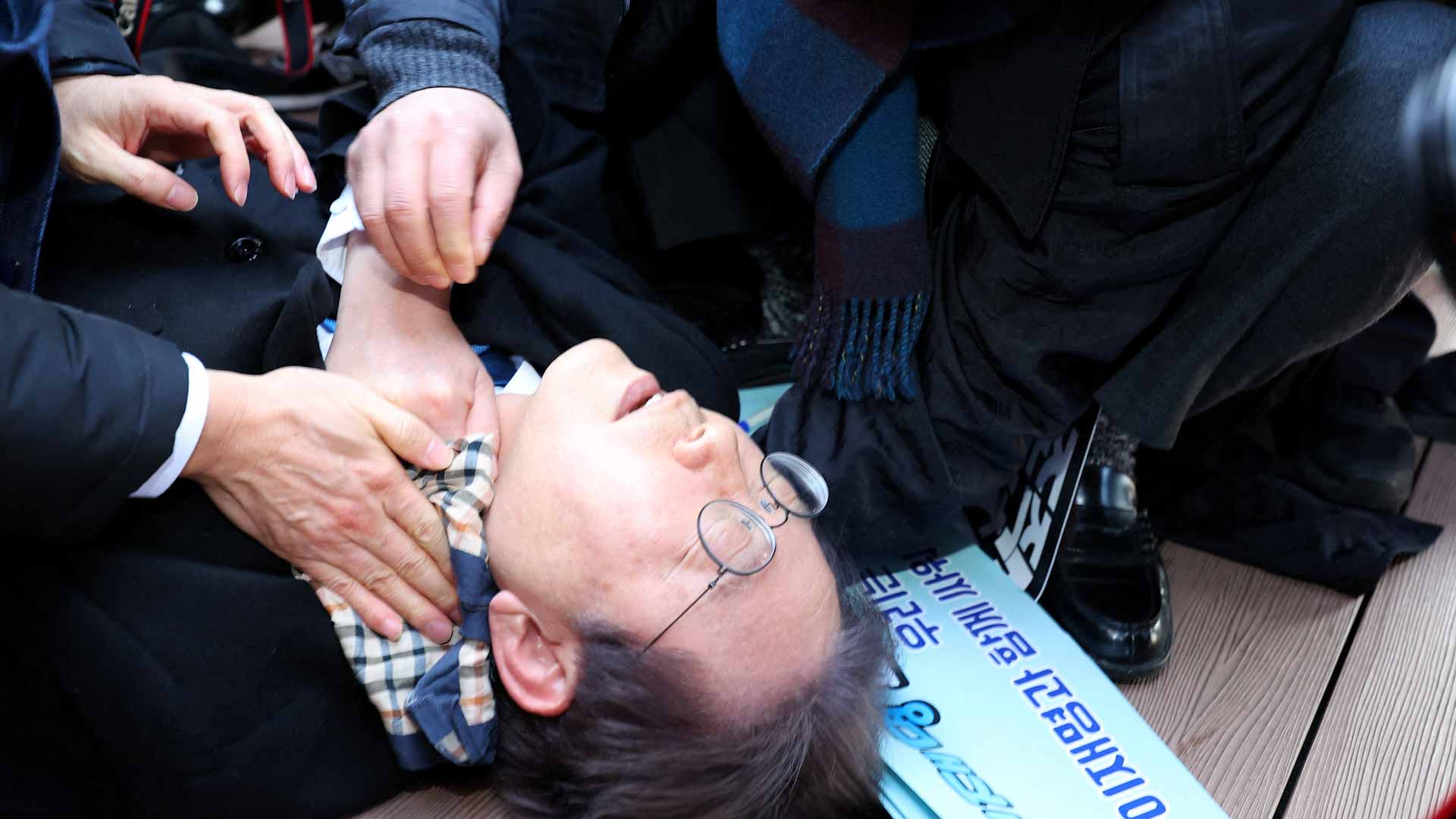 Image for the title: South Korean opposition leader stabbed in neck 