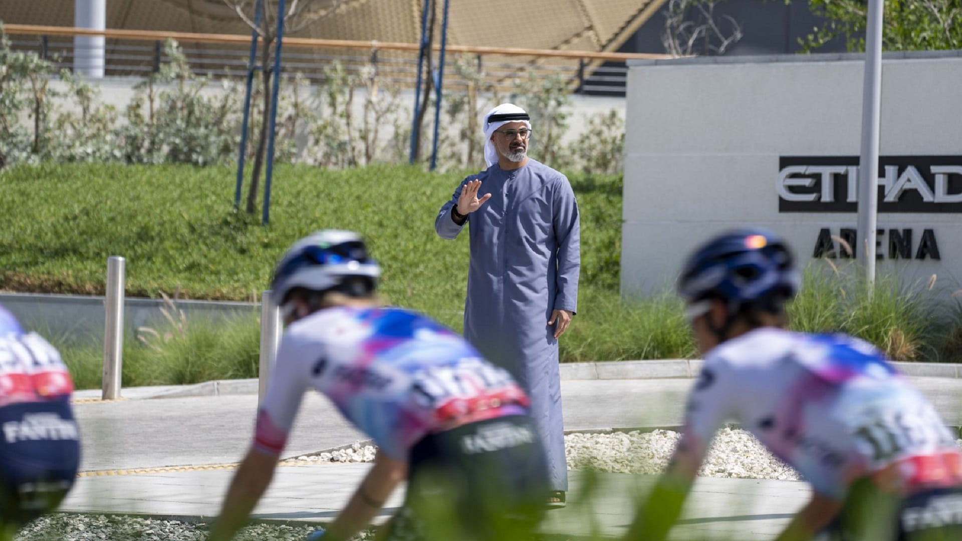 Image for the title: Khaled bin Mohamed greets cyclists in Stage 6 of UAE Tour 2023 
