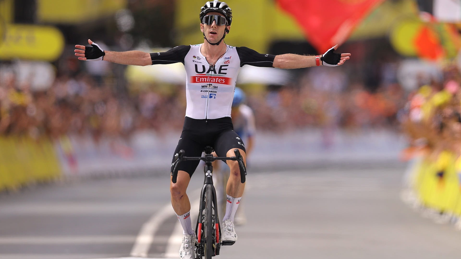 Image for the title: Adam Yates wins Tour de France opener ahead of twin brother 