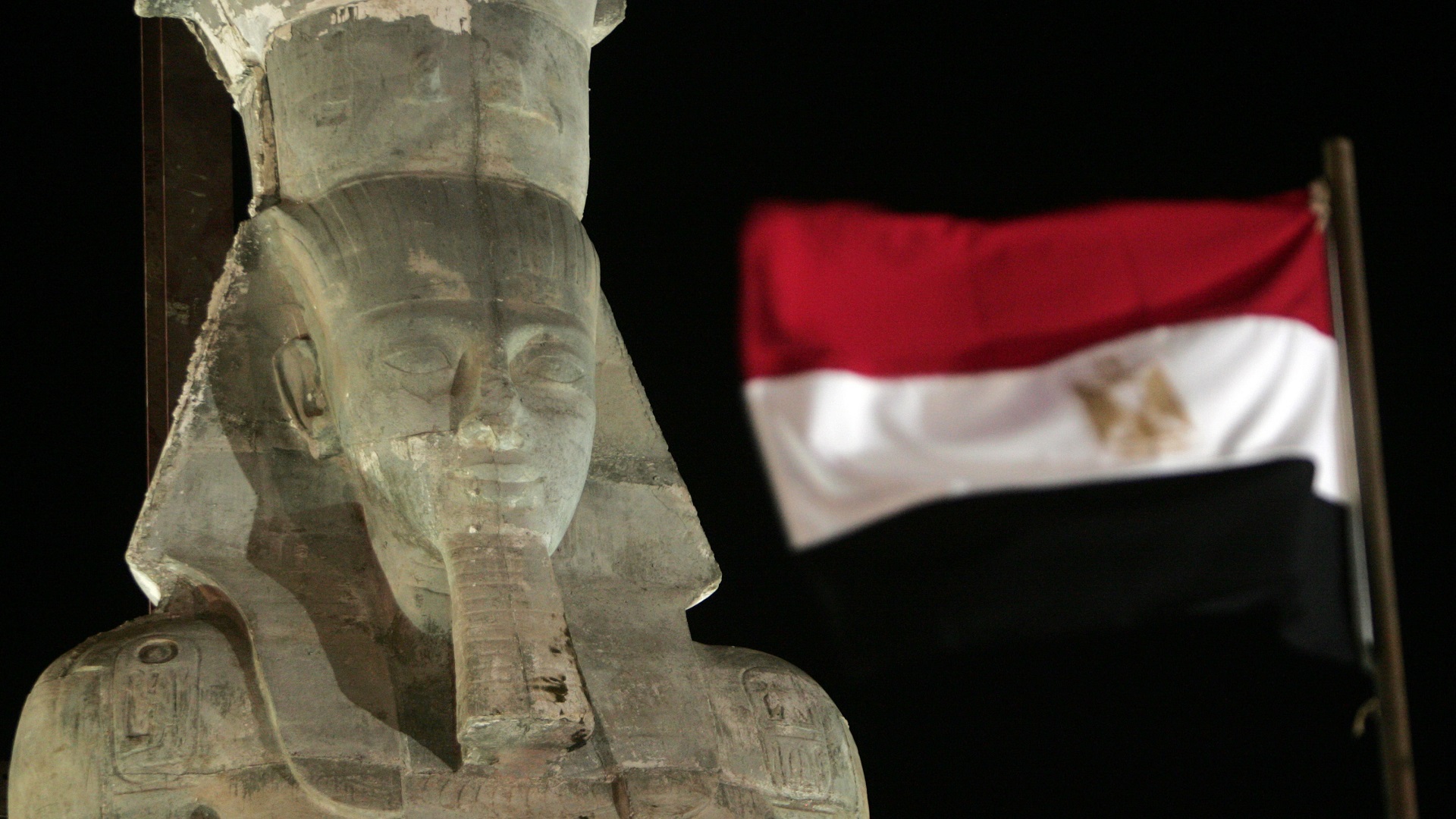 Image for the title: Swiss hand over stolen fragment of Ramses II statue to Egypt 