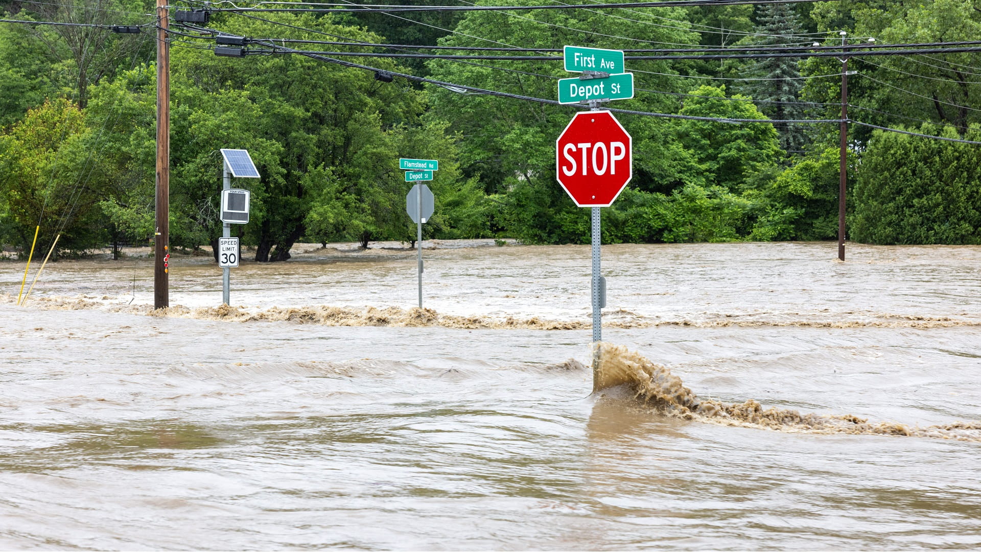 Image for the title: Flash floods rage in Vermont, New York; 50 rescued by swift boat 