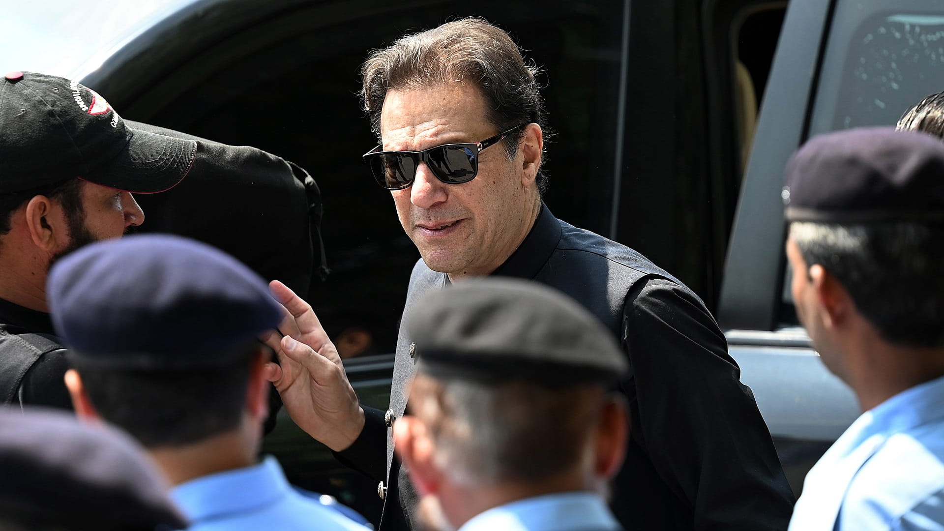 Image for the title: Pakistan election body issues arrest warrant for Imran Khan 